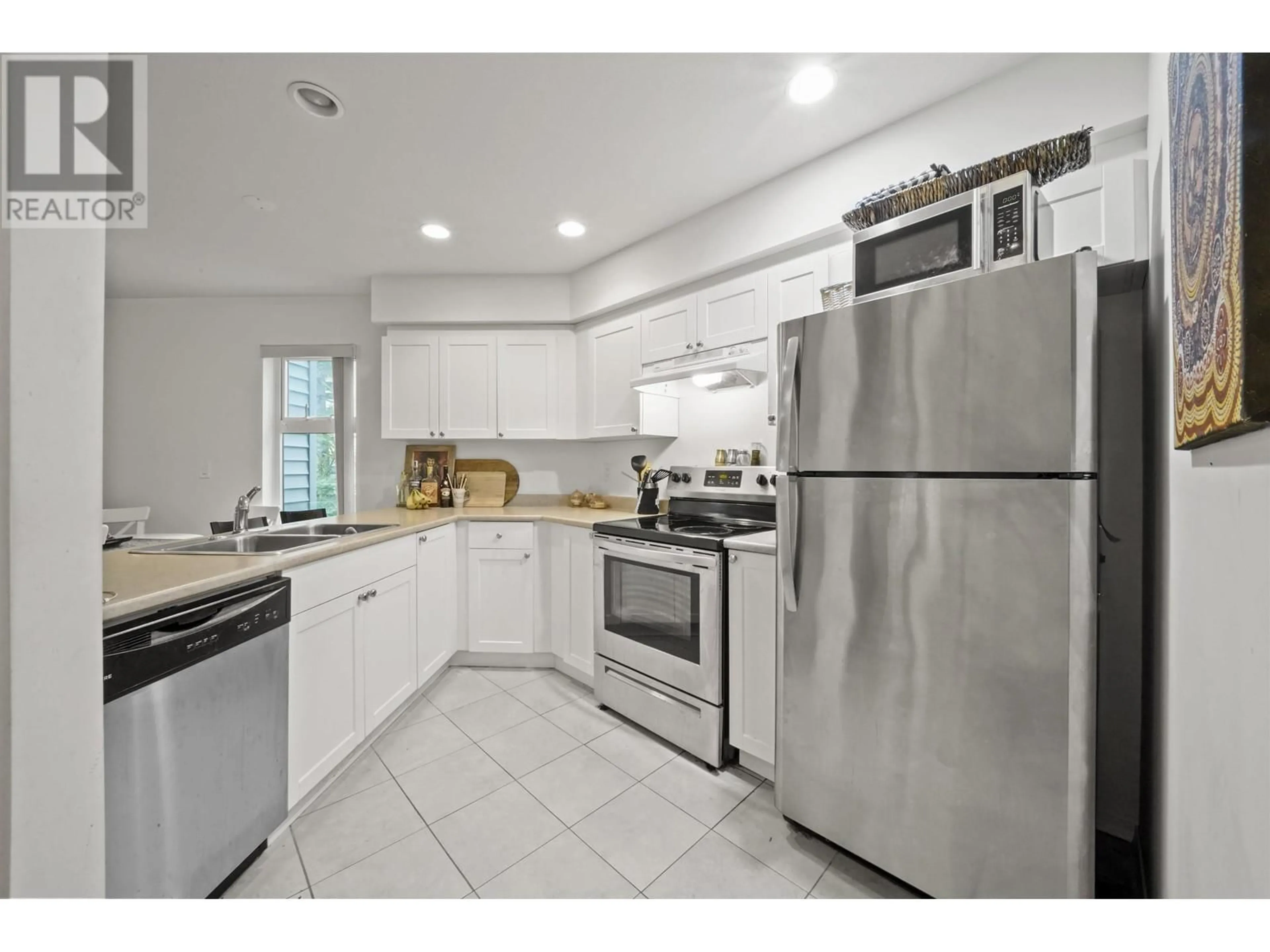 Standard kitchen, ceramic/tile floor for 209 2915 GLEN DRIVE, Coquitlam British Columbia V3B7H8