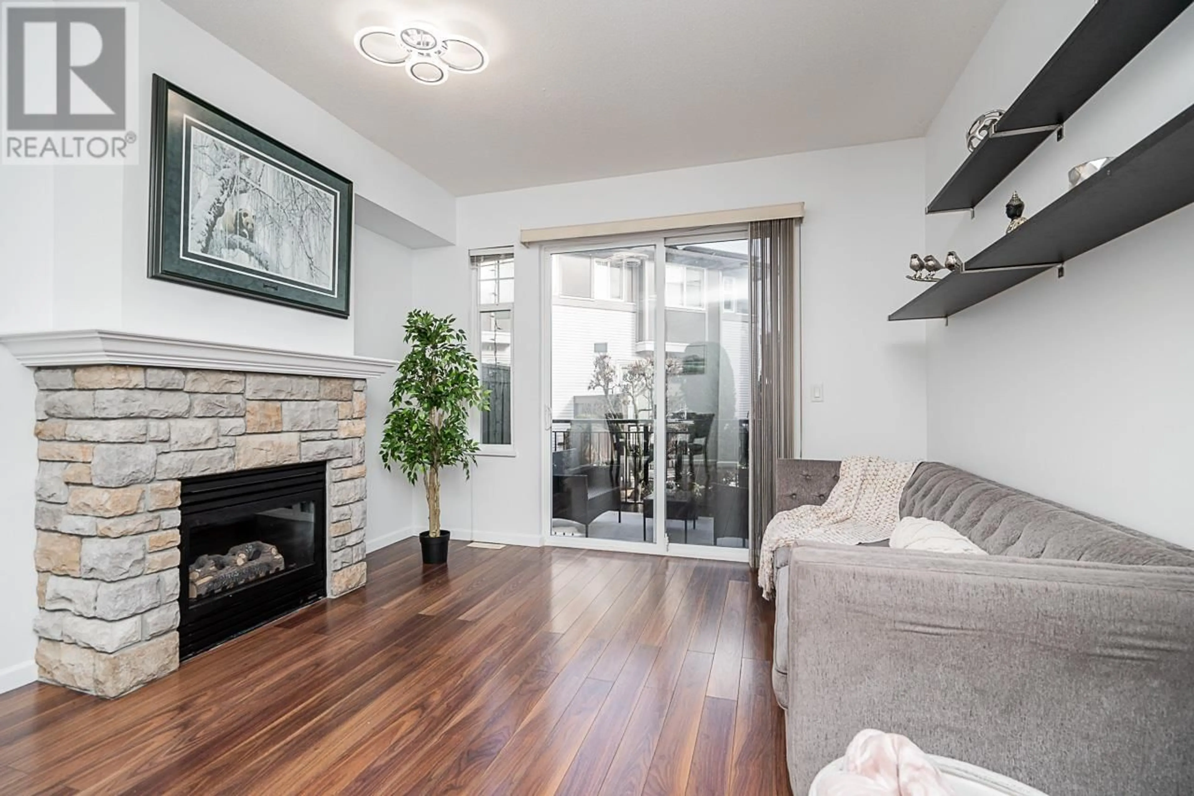 Living room with furniture, wood/laminate floor for 62 1010 EWEN AVENUE, New Westminster British Columbia V3M5C9