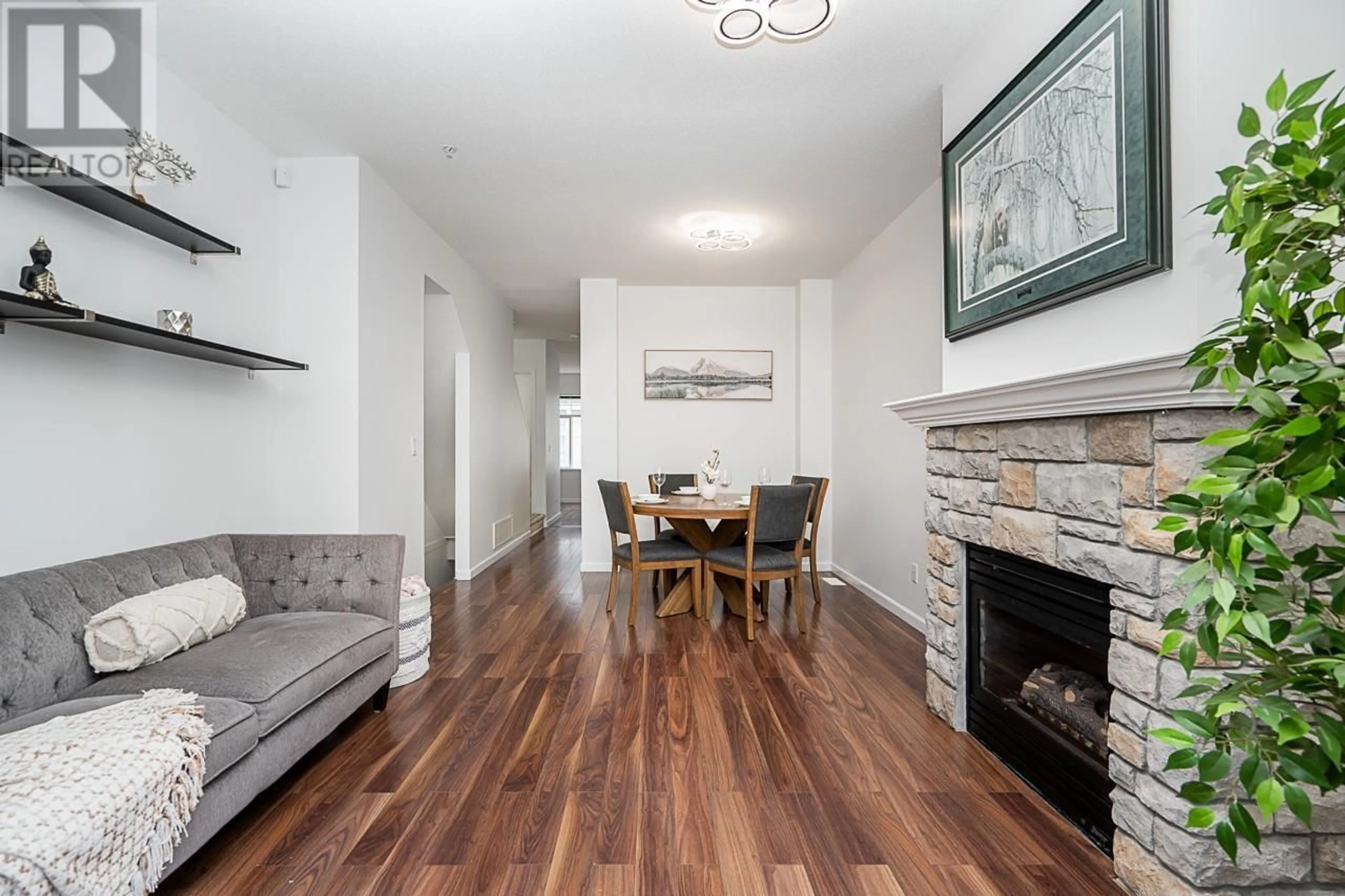 Living room with furniture, wood/laminate floor for 62 1010 EWEN AVENUE, New Westminster British Columbia V3M5C9