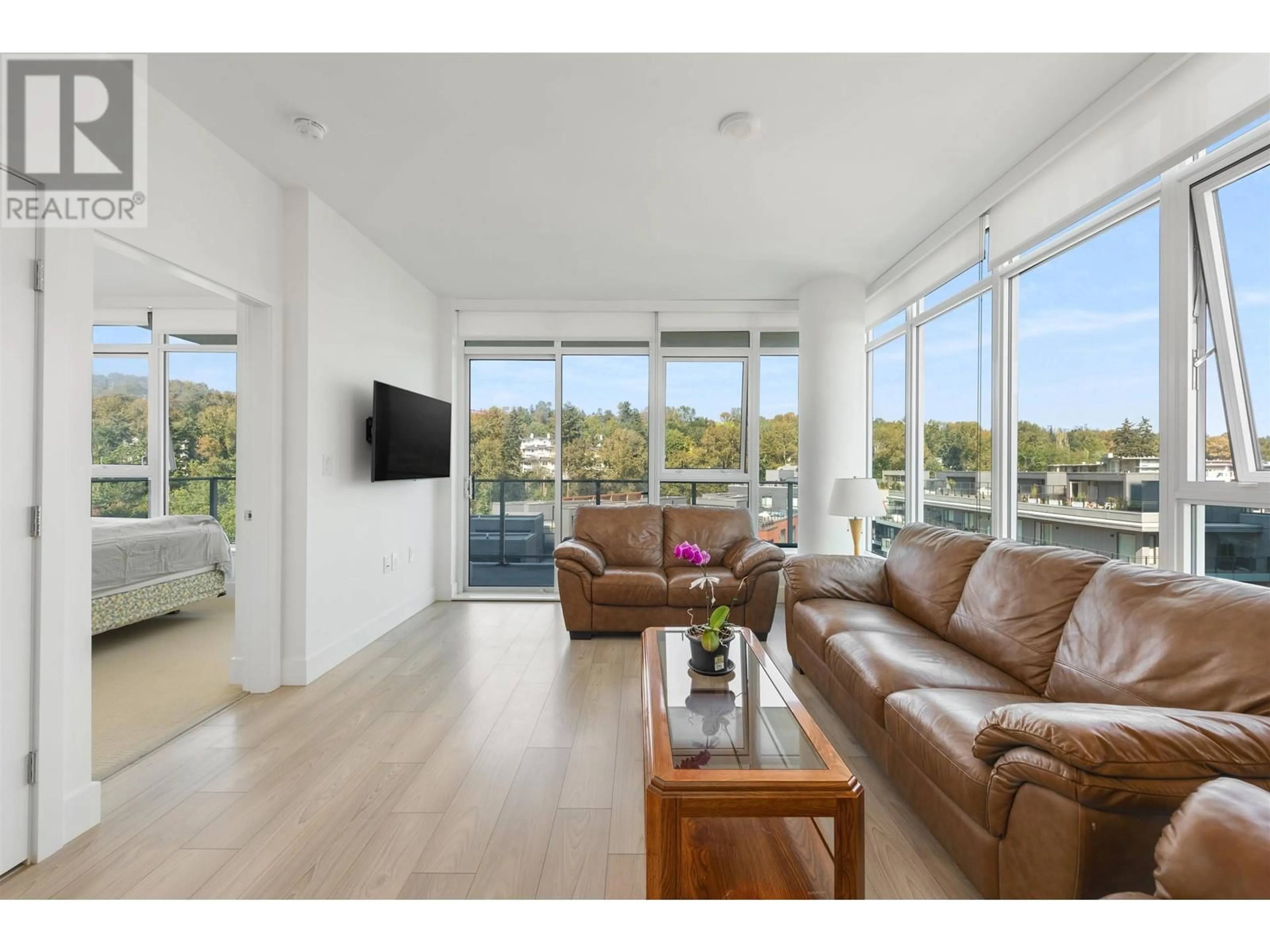 Living room with furniture, wood/laminate floor for 808 8570 RIVERGRASS DRIVE, Vancouver British Columbia V5S0H4