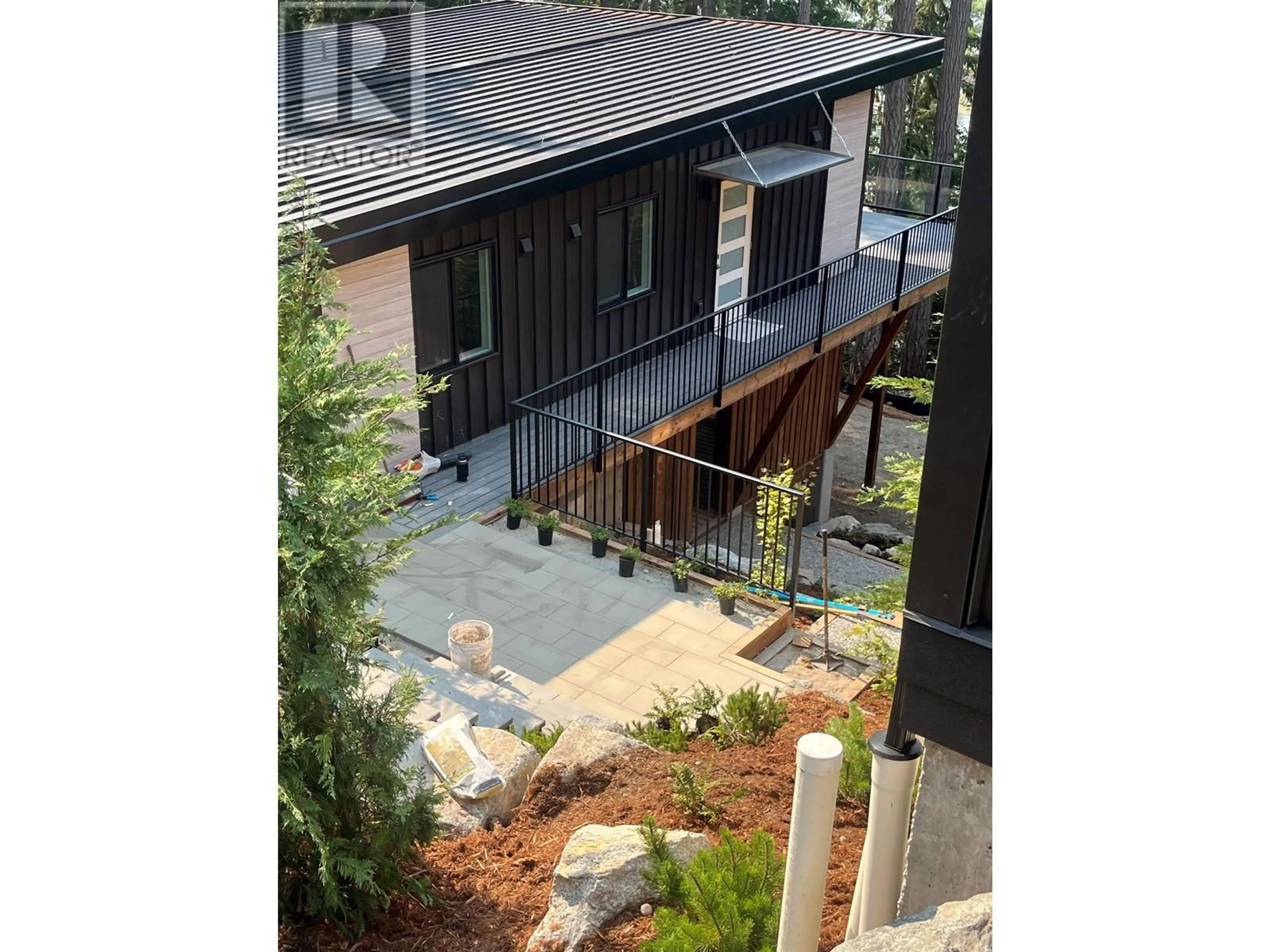 A pic from outside/outdoor area/front of a property/back of a property/a pic from drone, street for 5792 TILLICUM BAY ROAD, Sechelt British Columbia V7Z0C7