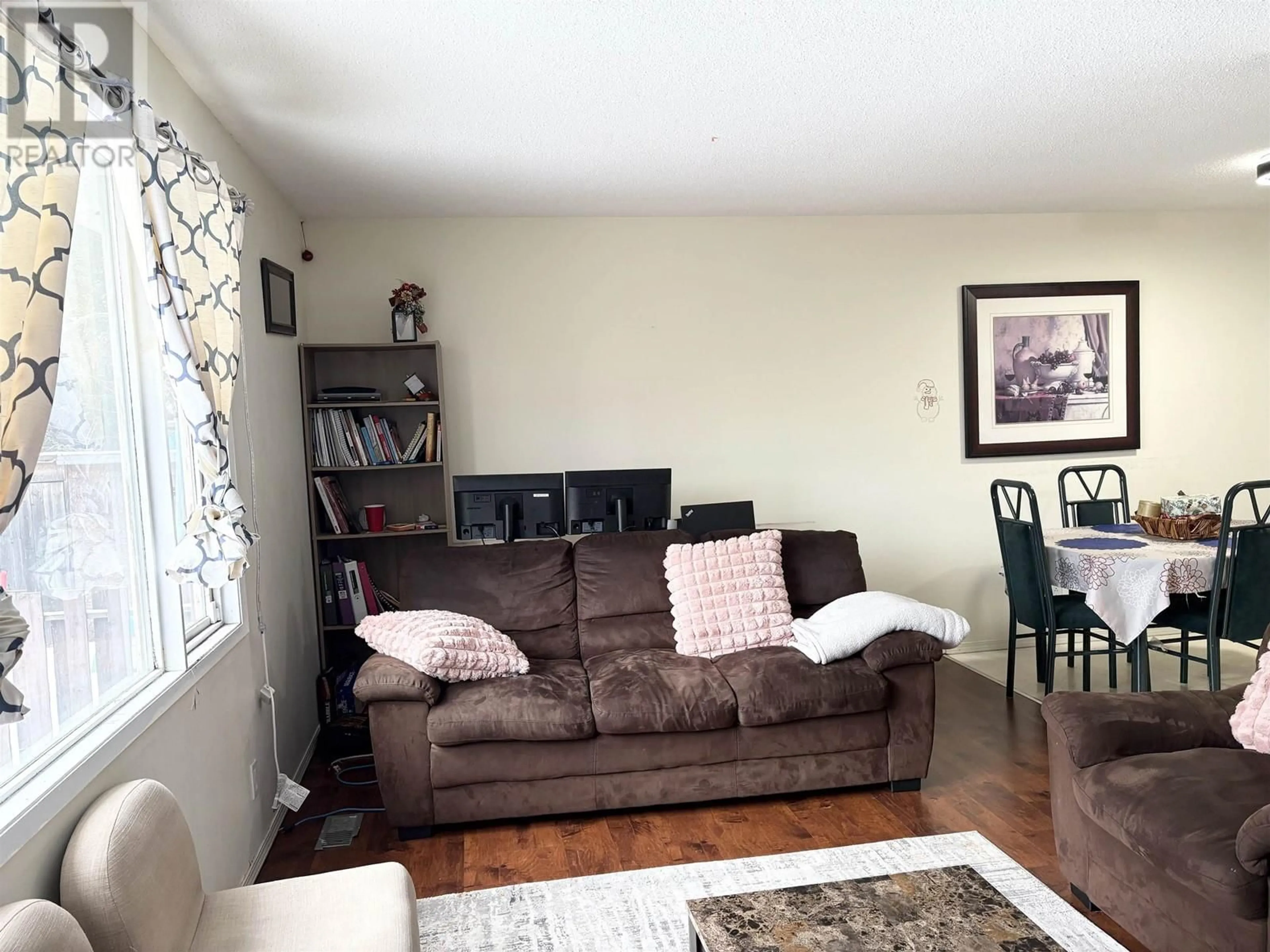 Living room with furniture, wood/laminate floor for 1479 NATION CRESCENT, Prince George British Columbia V2M4E3