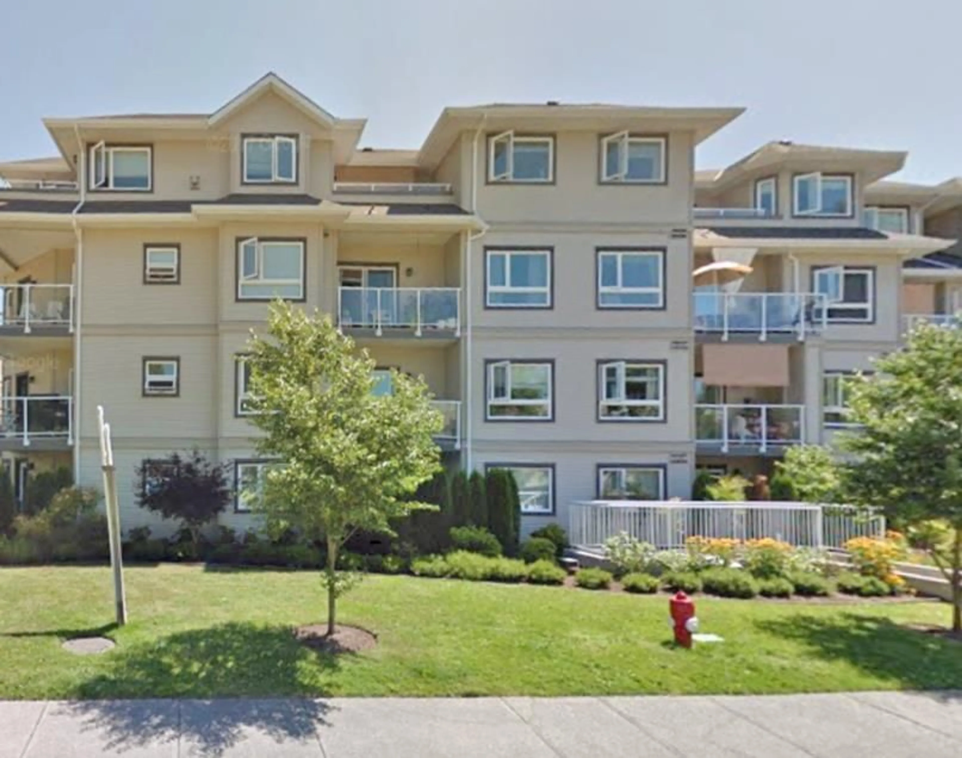 A pic from outside/outdoor area/front of a property/back of a property/a pic from drone, unknown for 113 8142 120A STREET, Surrey British Columbia V3W0N1