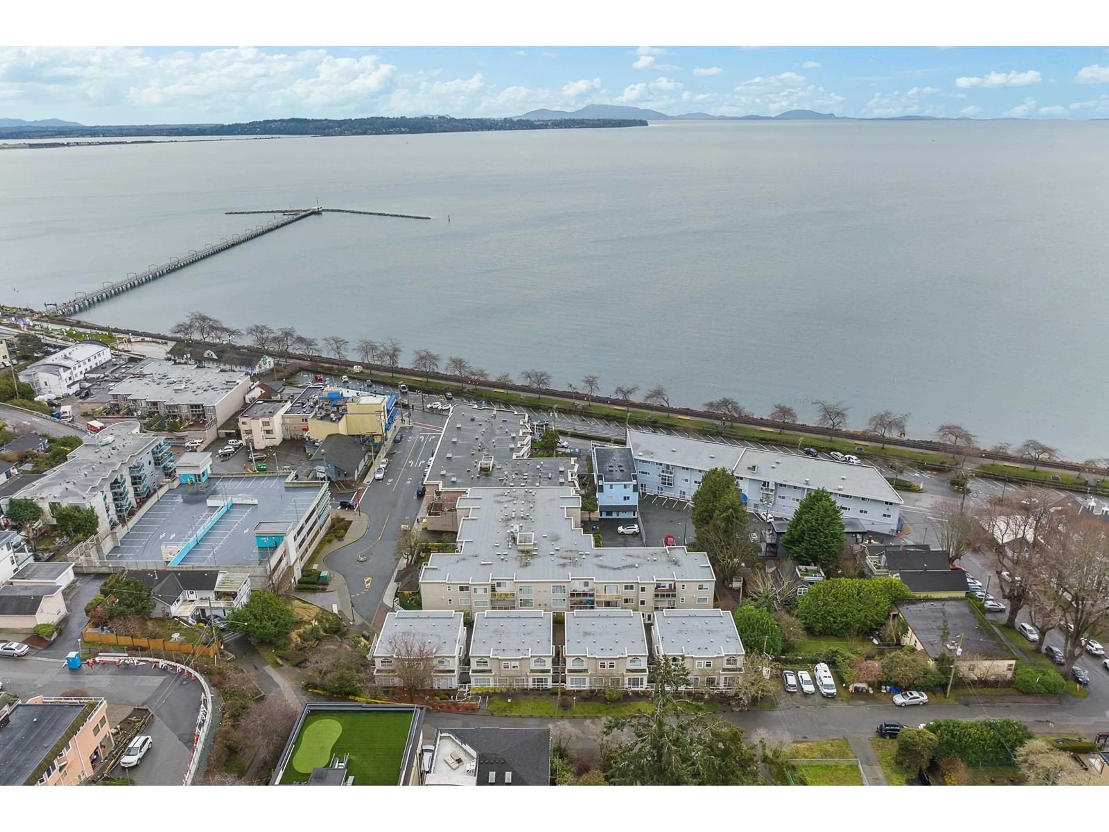 A pic from outside/outdoor area/front of a property/back of a property/a pic from drone, water/lake/river/ocean view for 201 1153 VIDAL STREET, White Rock British Columbia V4B3T4