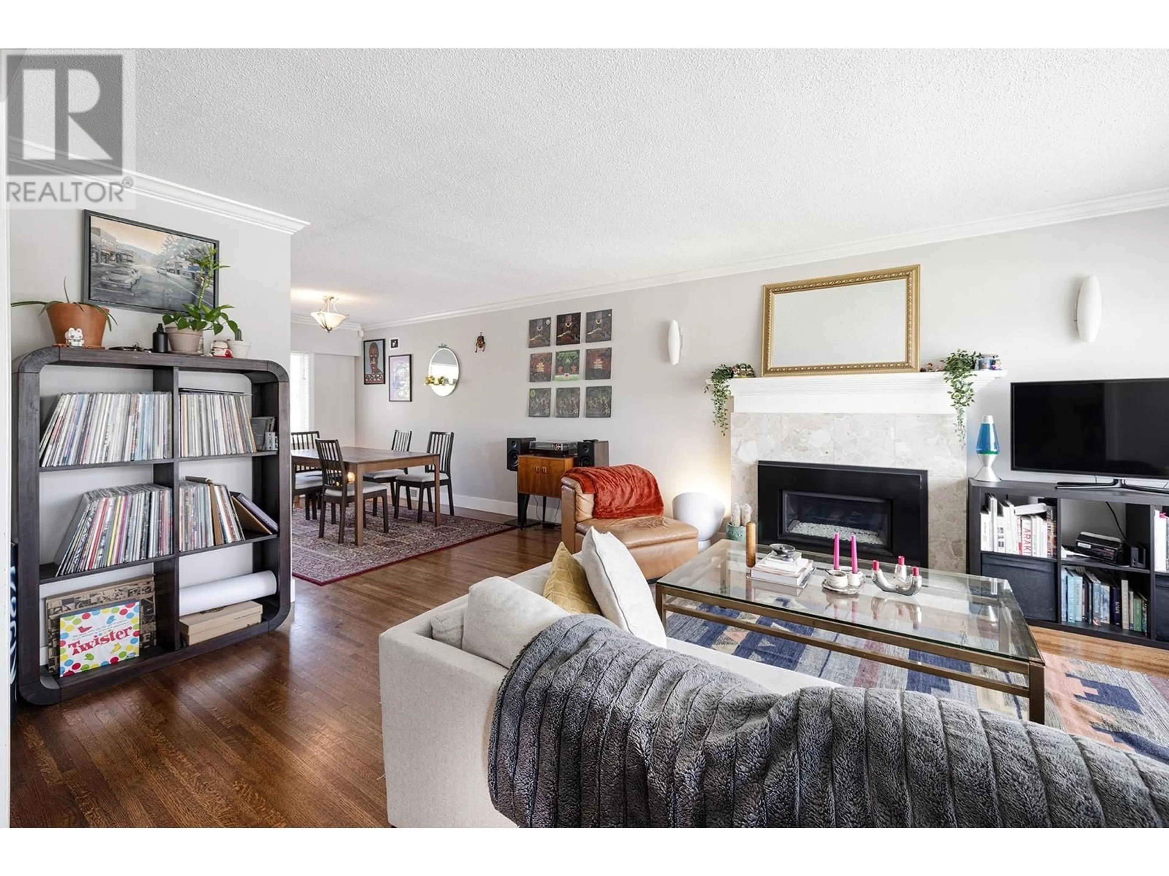 Living room with furniture, wood/laminate floor for 4378 BRIARWOOD CRESCENT, Burnaby British Columbia V5G2M6