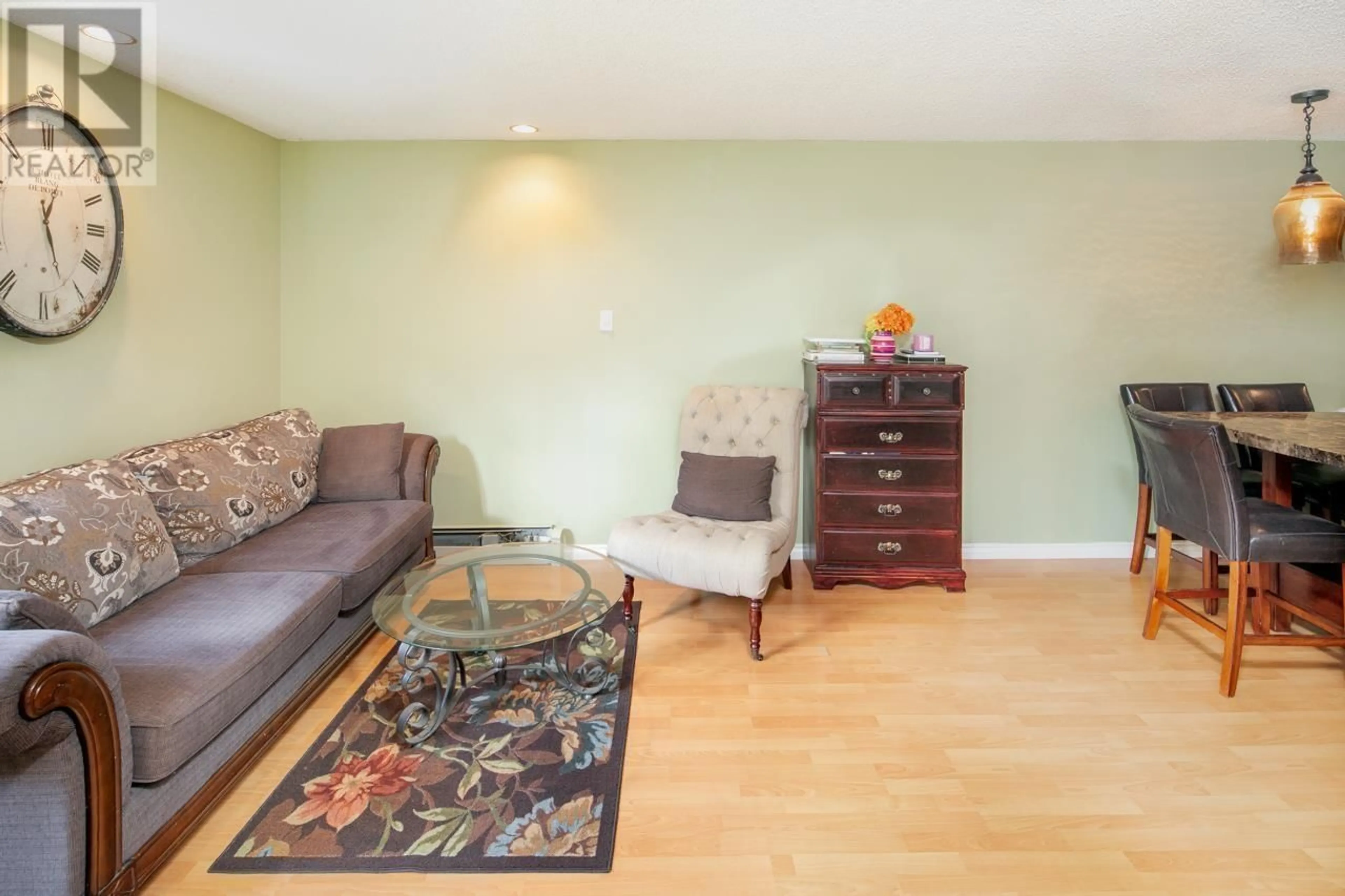 Living room with furniture, wood/laminate floor for 102 1500 PENDRELL STREET, Vancouver British Columbia V6G3A5