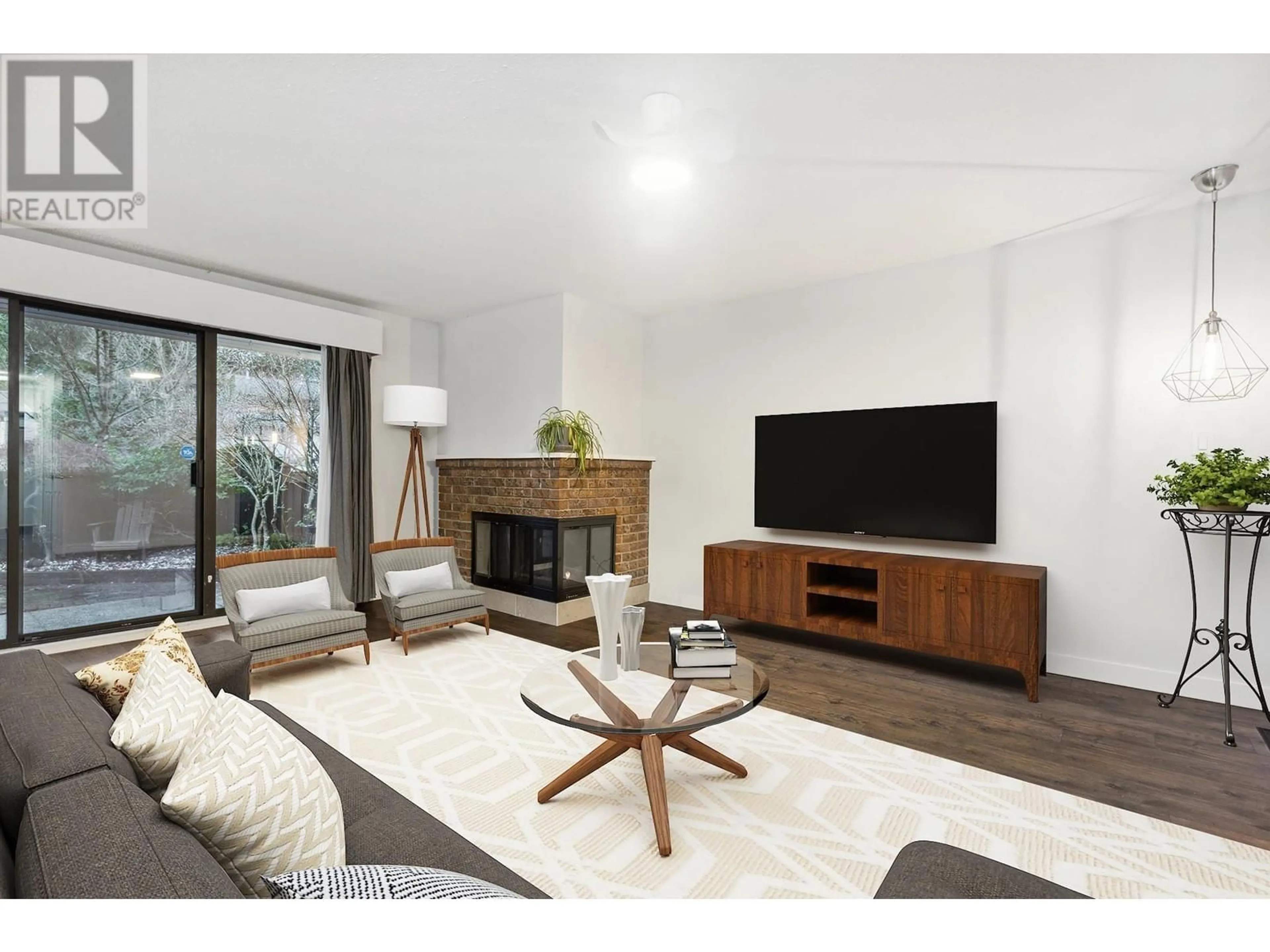 Living room with furniture, wood/laminate floor for 11 3350 ROSEMONT DRIVE, Vancouver British Columbia V5S2C9