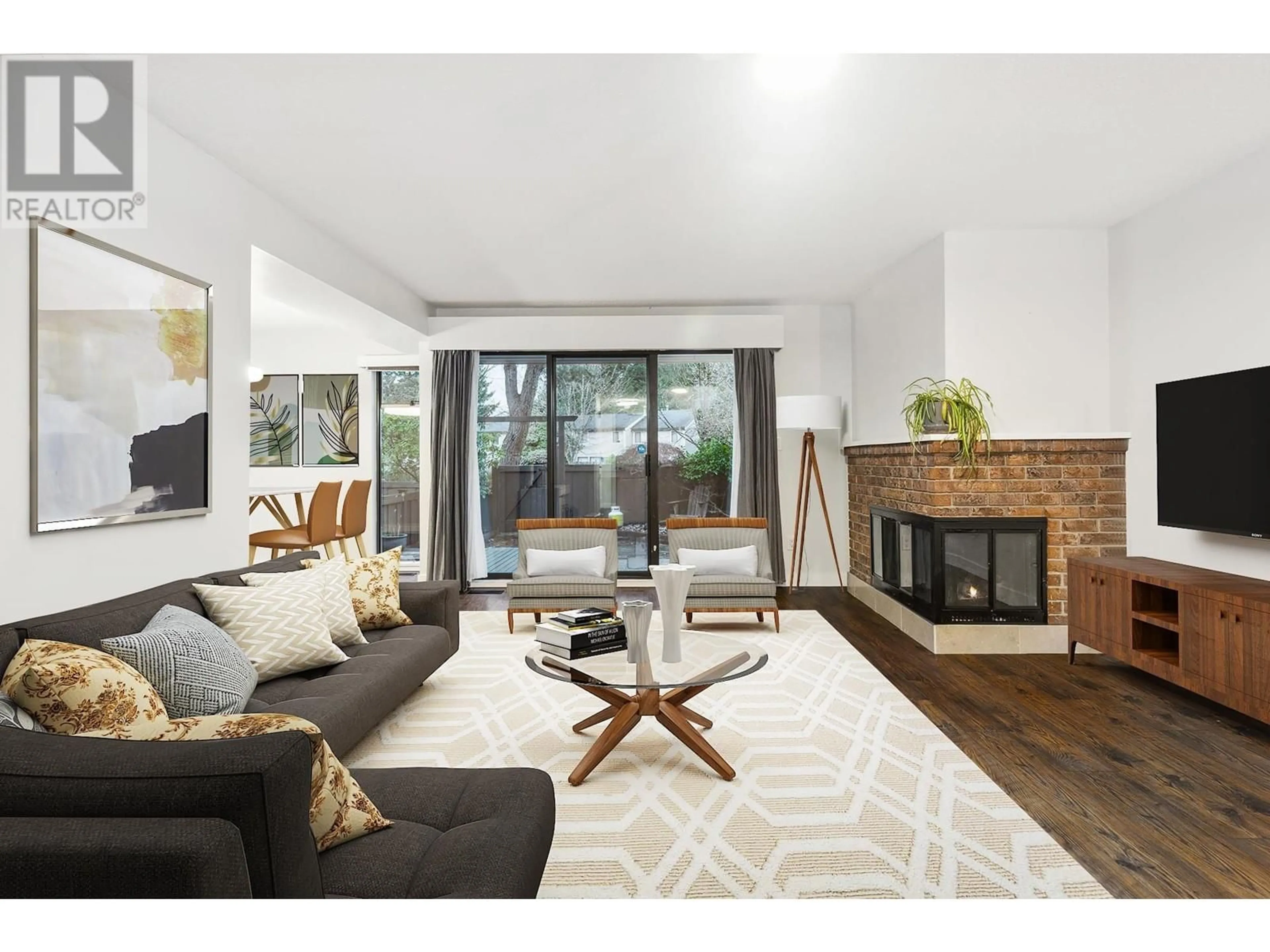 Living room with furniture, wood/laminate floor for 11 3350 ROSEMONT DRIVE, Vancouver British Columbia V5S2C9