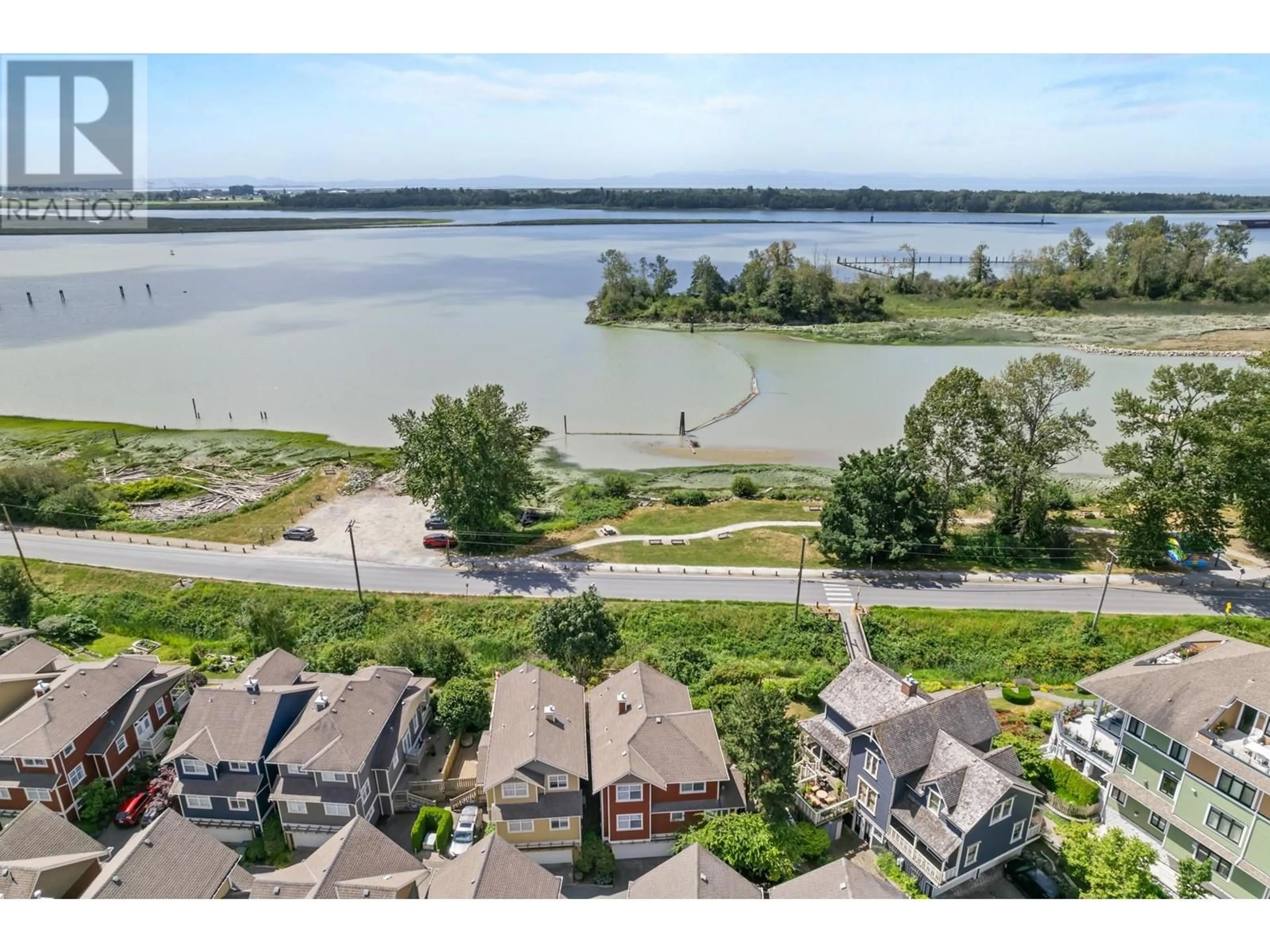 A pic from outside/outdoor area/front of a property/back of a property/a pic from drone, water/lake/river/ocean view for 1 13400 PRINCESS STREET, Richmond British Columbia V7E6R5