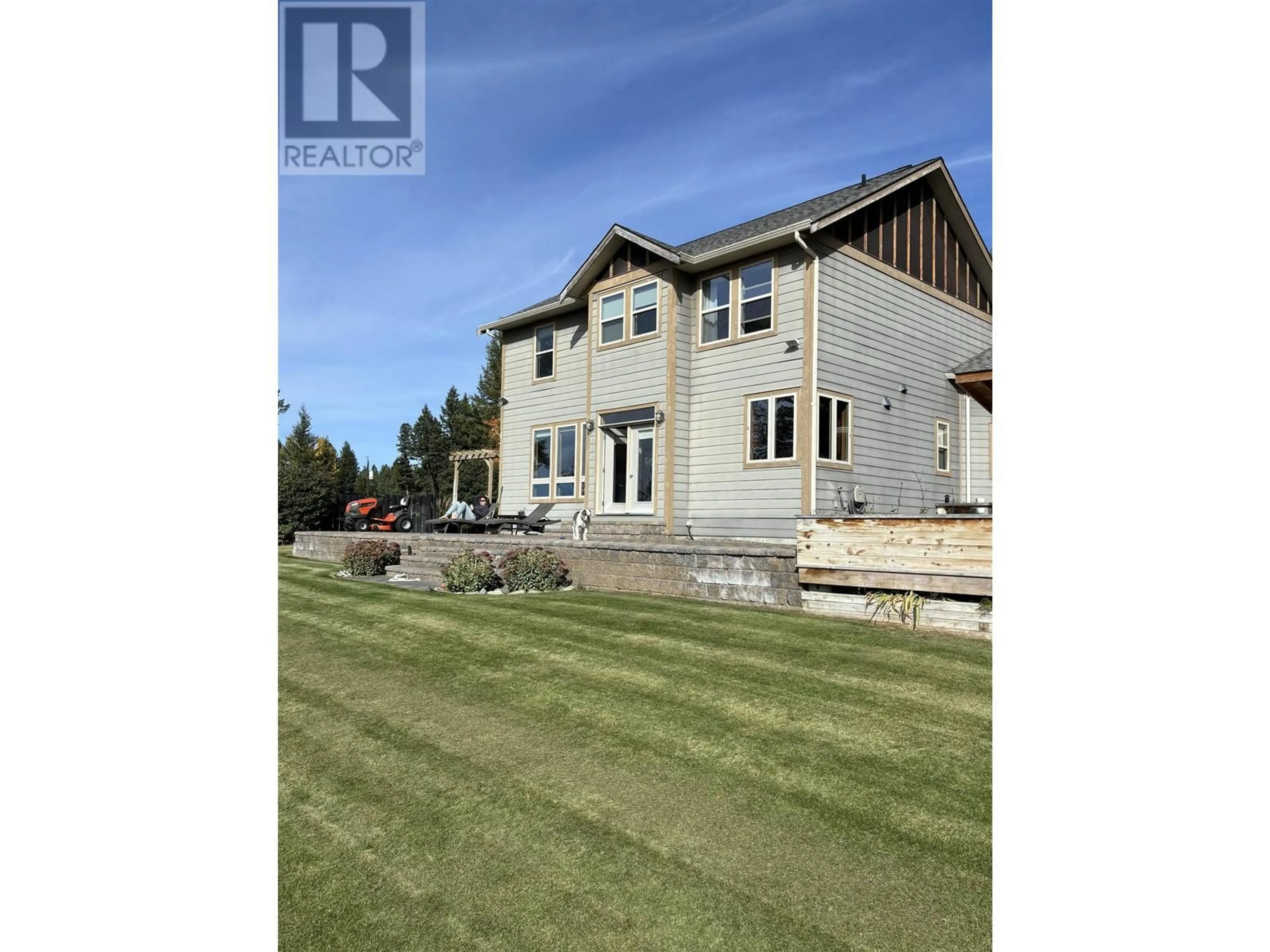A pic from outside/outdoor area/front of a property/back of a property/a pic from drone, water/lake/river/ocean view for 4872 GLOINNZUN CRESCENT, 108 Mile Ranch British Columbia V0K2Z0