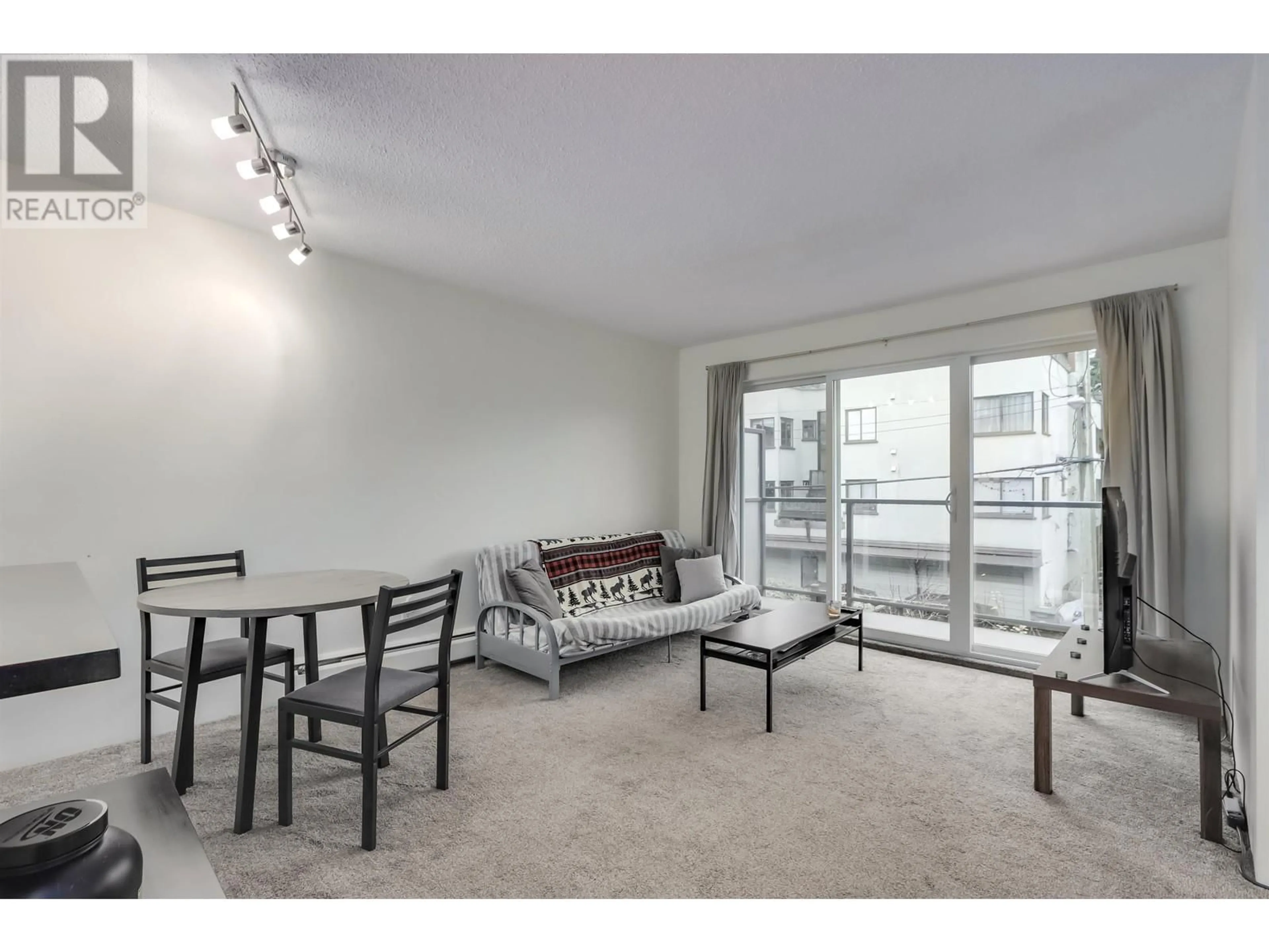 Living room with furniture, unknown for 207 1450 LABURNUM STREET, Vancouver British Columbia V6J3W3