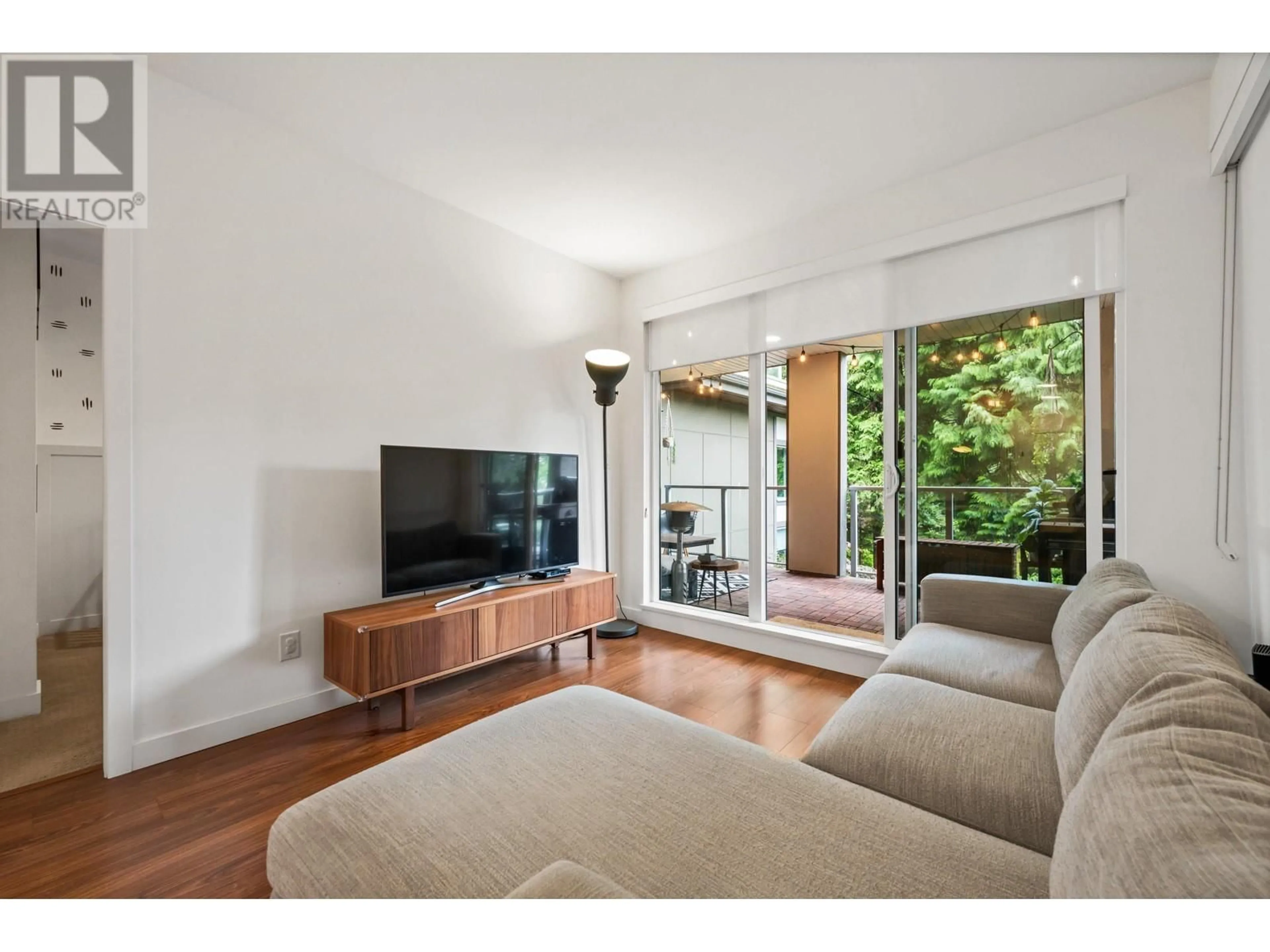 Living room with furniture, wood/laminate floor for 201 5460 BROADWAY, Burnaby British Columbia V5B0B4