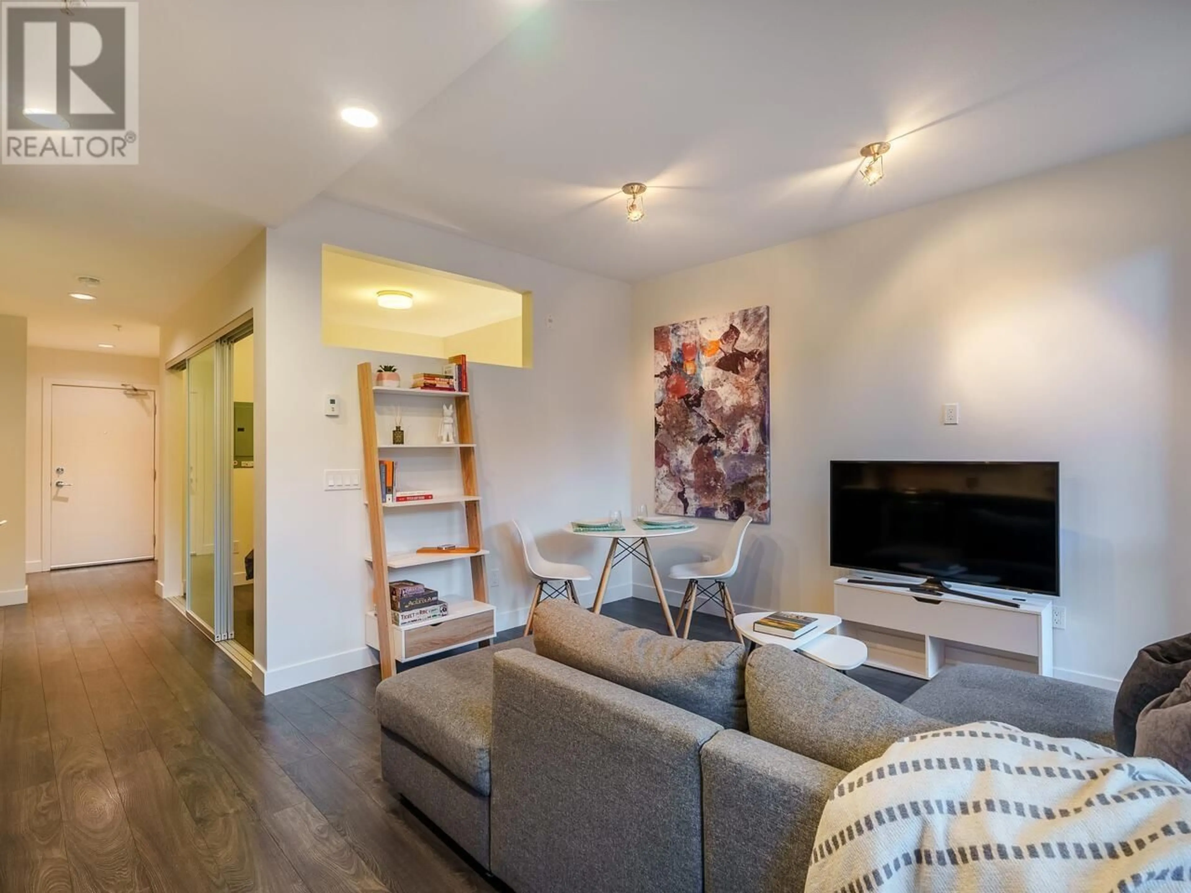 Living room with furniture, wood/laminate floor for 213 733 W 3RD STREET, North Vancouver British Columbia V7M0C8