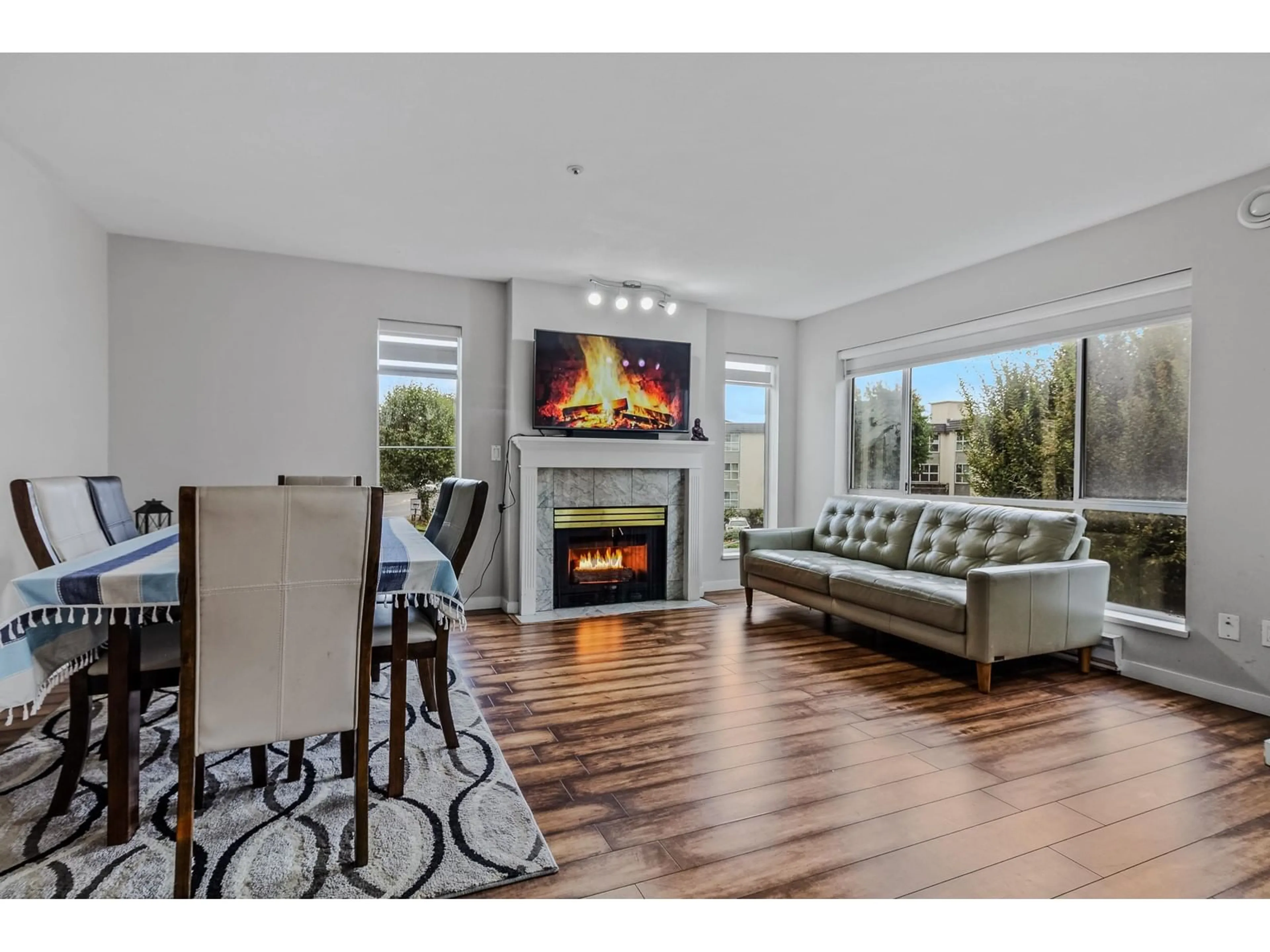 Living room with furniture, wood/laminate floor for 238 32830 GEORGE FERGUSON WAY, Abbotsford British Columbia V2S7K1