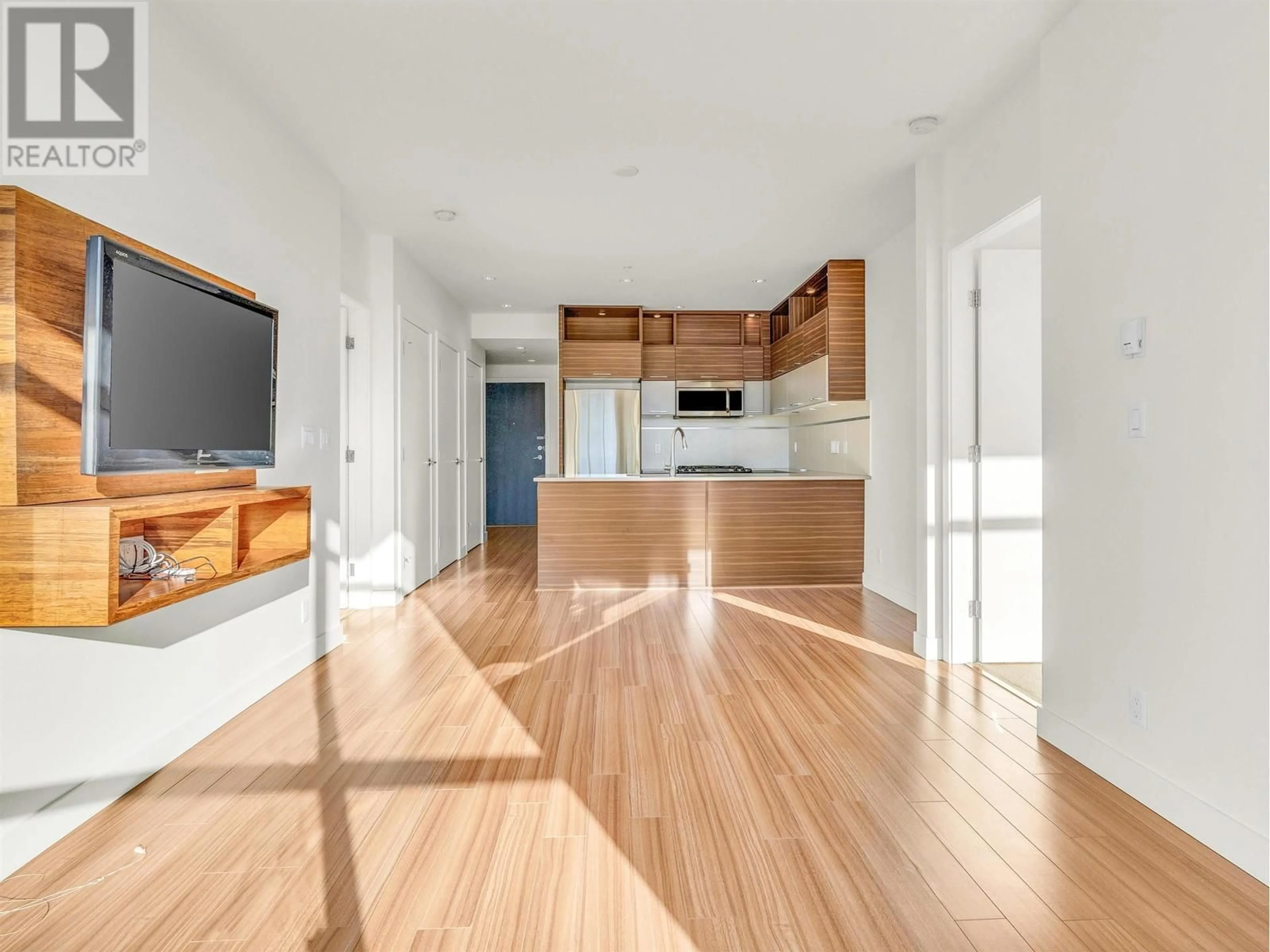 Open concept kitchen, wood/laminate floor for 301 - 9150 UNIVERSITY HIGH STREET, Burnaby British Columbia V5A0C5