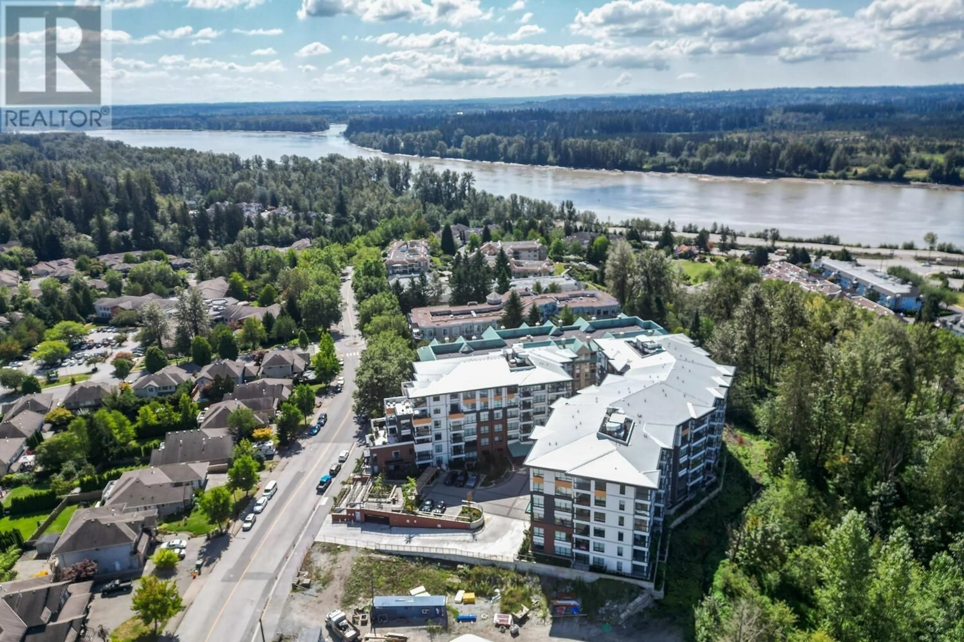 A pic from outside/outdoor area/front of a property/back of a property/a pic from drone, water/lake/river/ocean view for 310 11641 227 STREET, Maple Ridge British Columbia V2X9J6