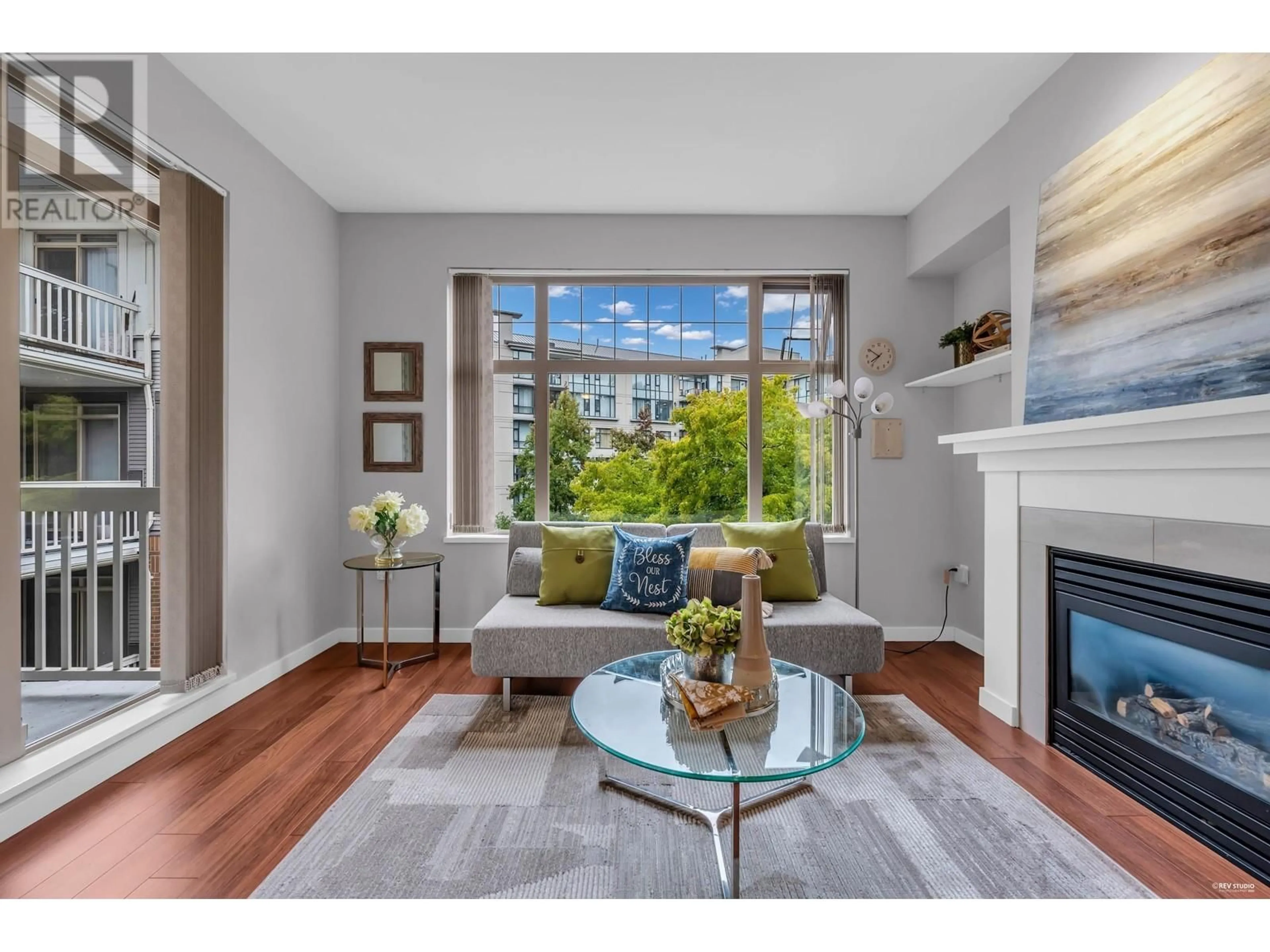 Living room with furniture, wood/laminate floor for 311 - 4883 MACLURE MEWS, Vancouver British Columbia V6J5M8