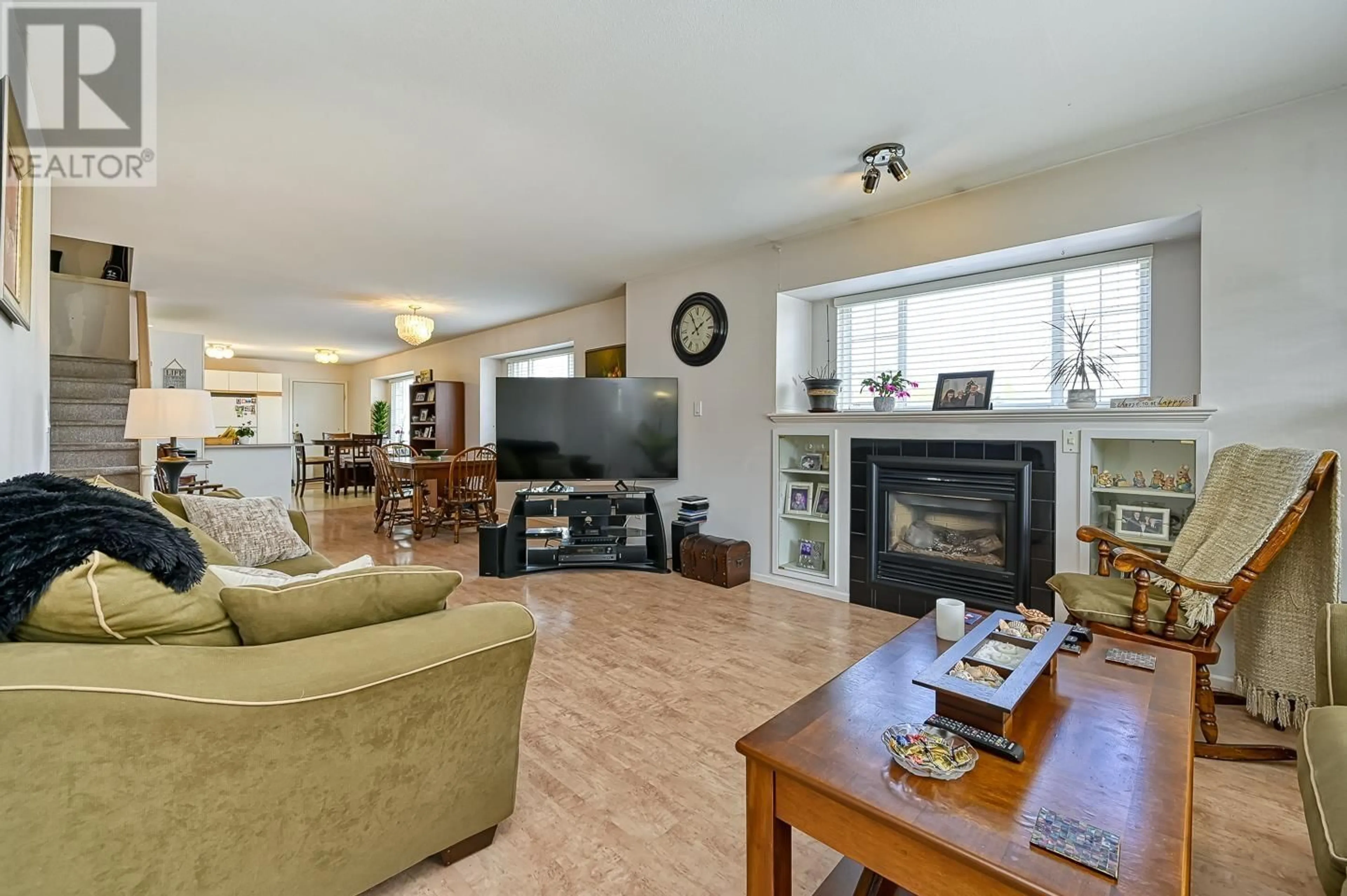 Living room with furniture, wood/laminate floor for 711 RIVERSIDE DRIVE, Port Coquitlam British Columbia V3B7T7