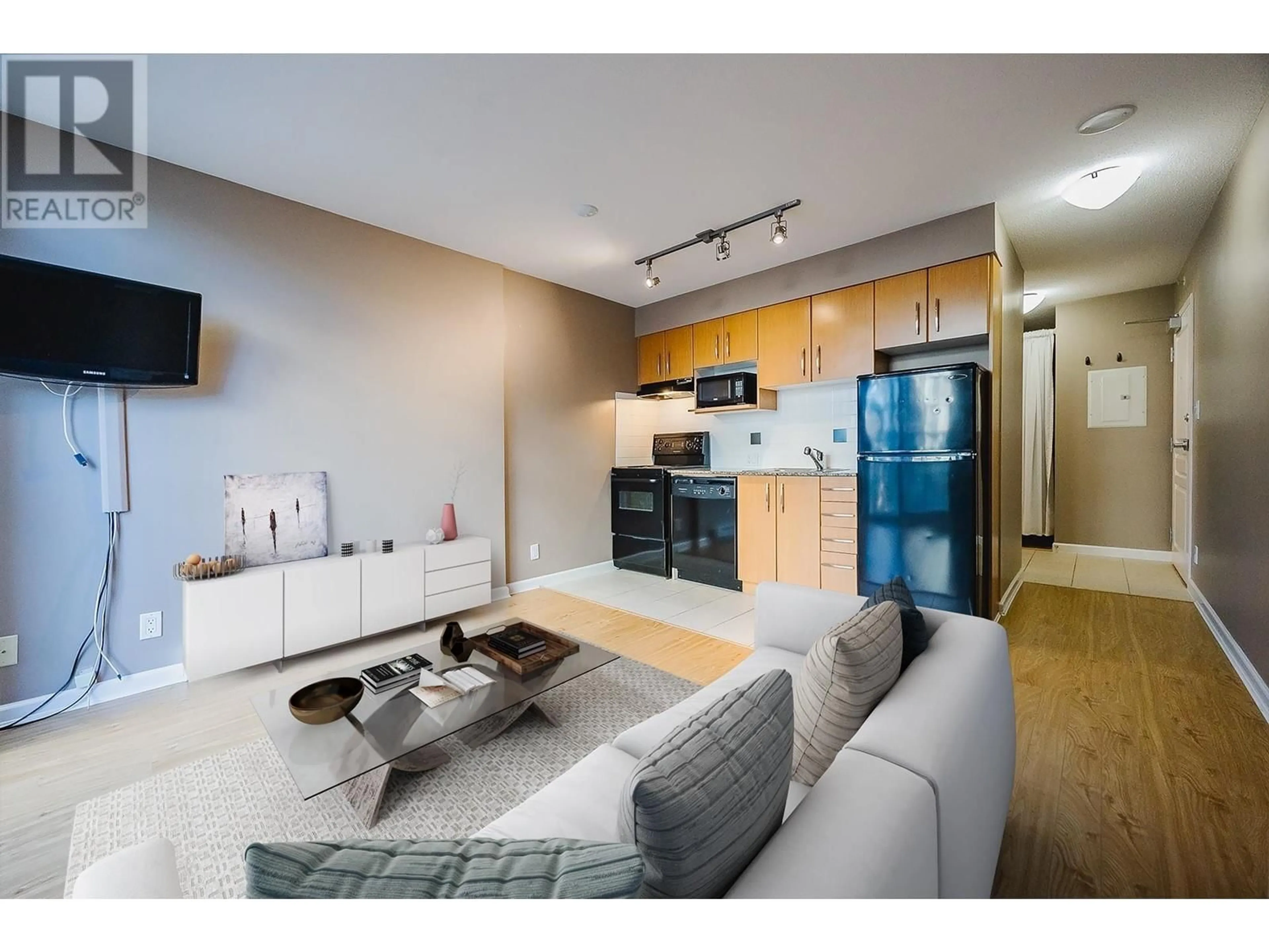 Living room with furniture, unknown for 202 - 9288 UNIVERSITY CRESCENT, Burnaby British Columbia V5A4X7