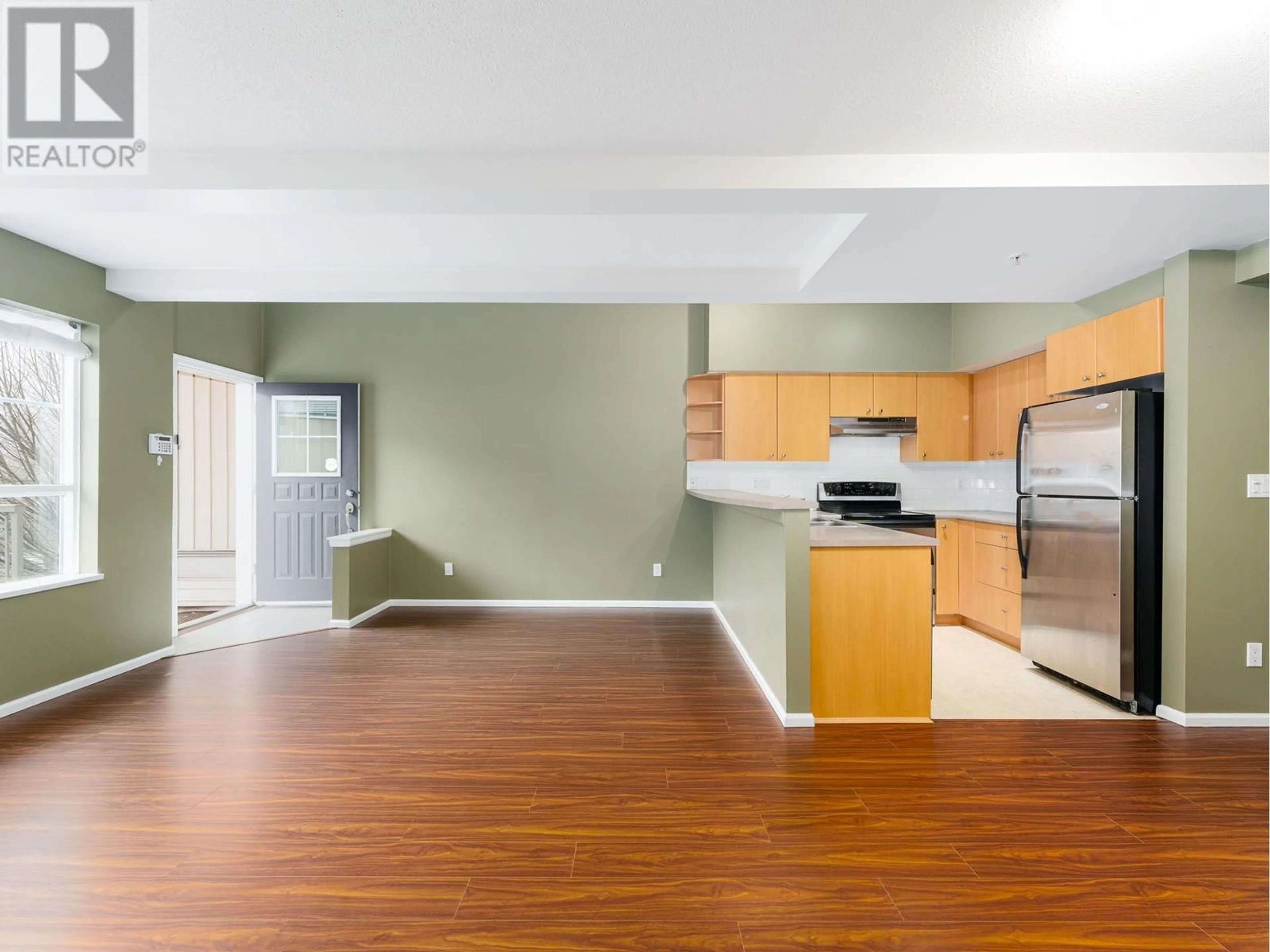 Open concept kitchen, wood/laminate floor for 38 - 7088 17 AVENUE, Burnaby British Columbia V3N1K5