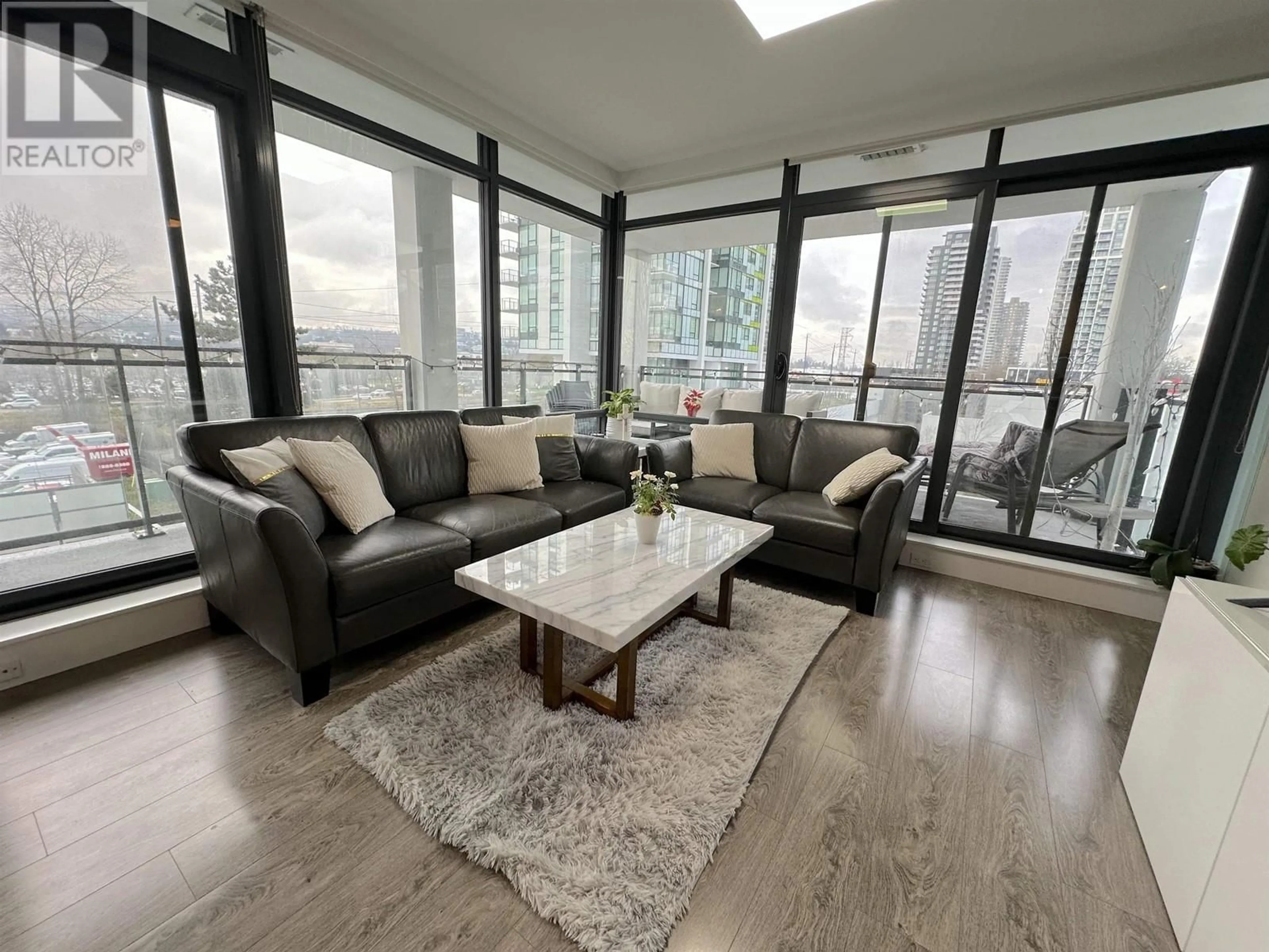 Living room with furniture, wood/laminate floor for 406 2378 ALPHA AVENUE, Burnaby British Columbia V5C0K2