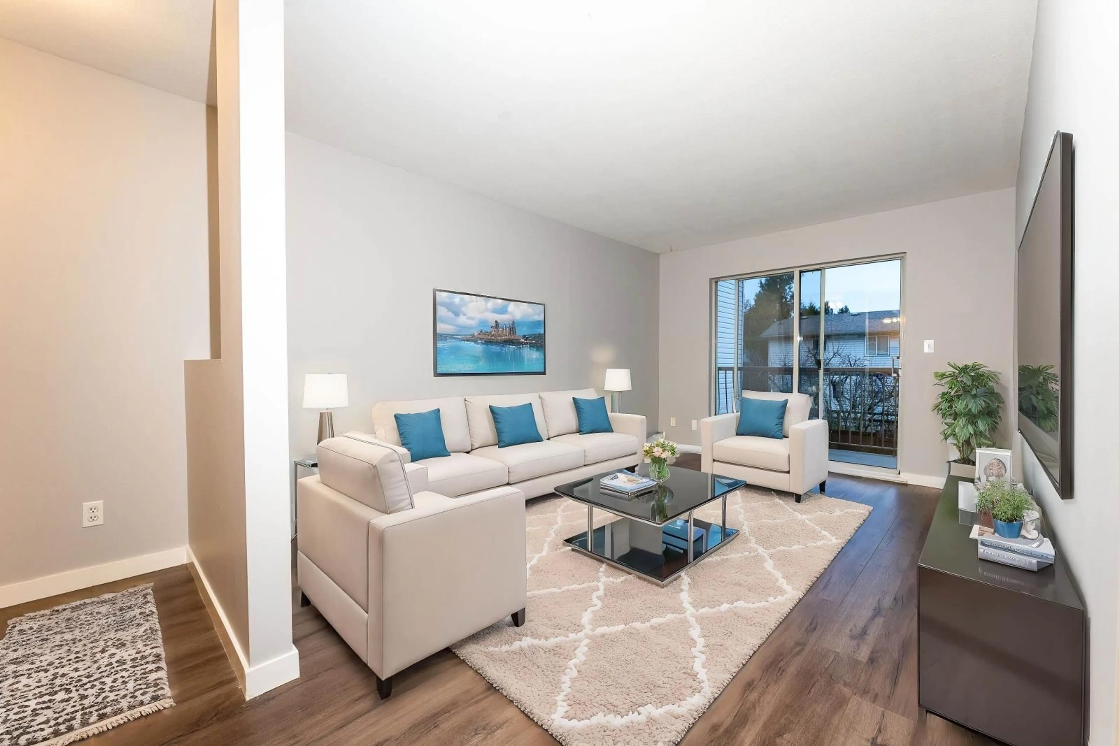 Living room with furniture, wood/laminate floor for 203 45702 WATSON ROAD|Garrison Crossing, Chilliwack British Columbia V2R3E6