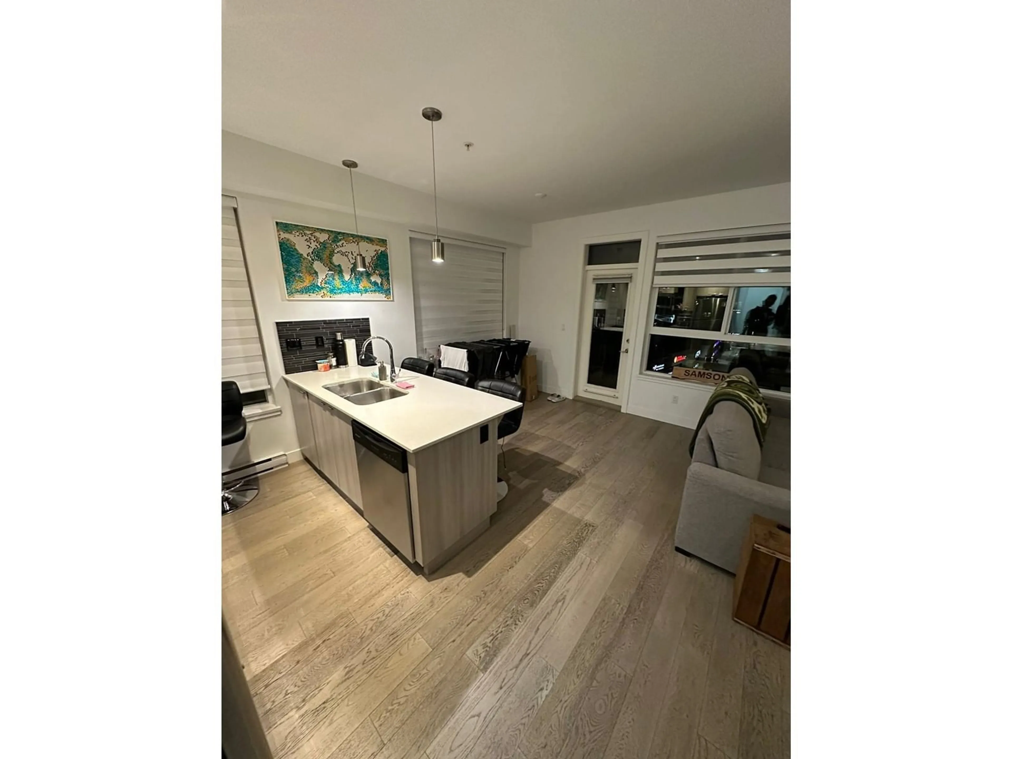 Open concept kitchen, wood/laminate floor for 503 3090 GLADWIN ROAD, Abbotsford British Columbia V2T0G2