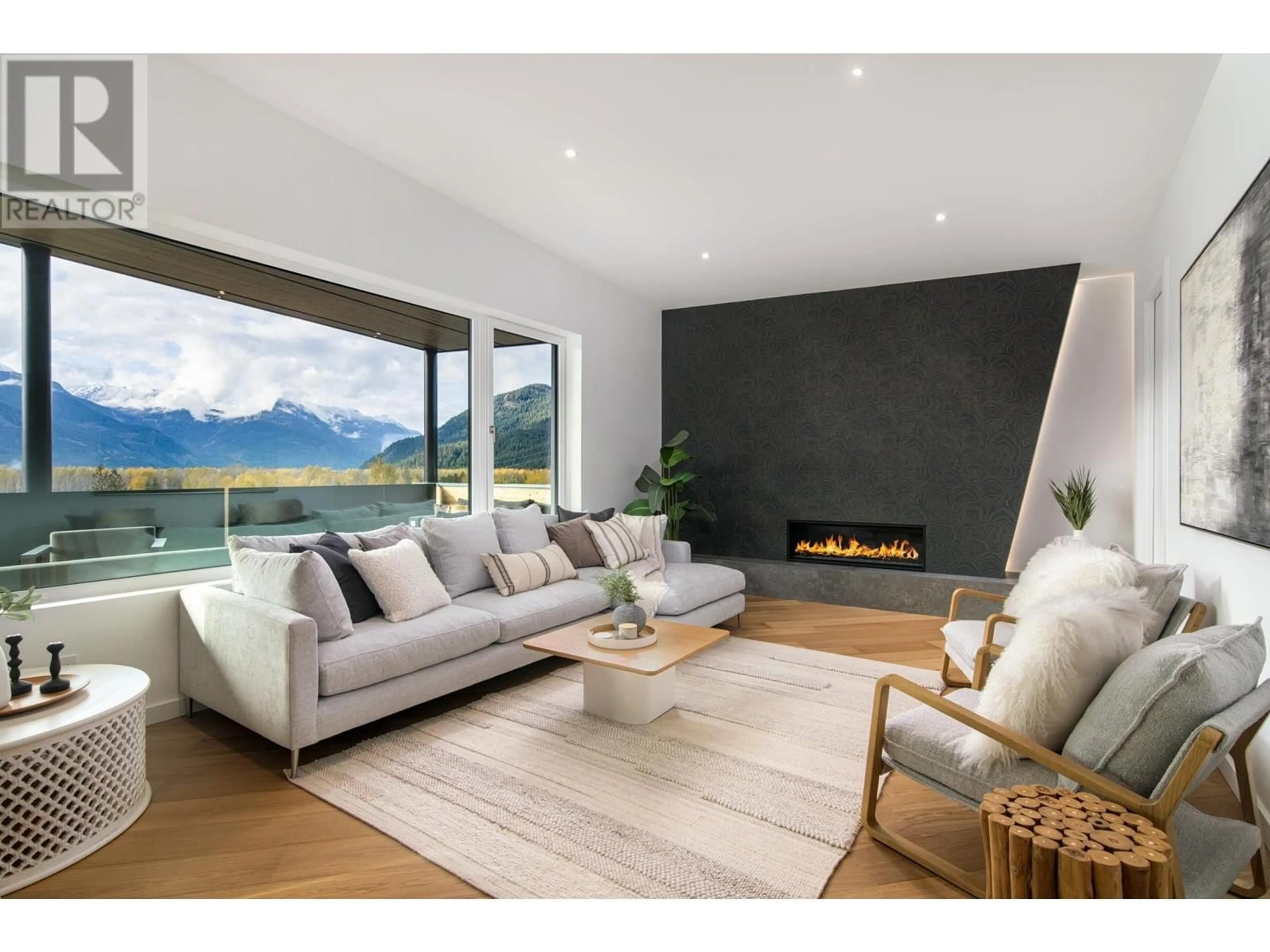 Living room with furniture, wood/laminate floor for 1780 PINEWOOD DRIVE, Pemberton British Columbia V0N2L3