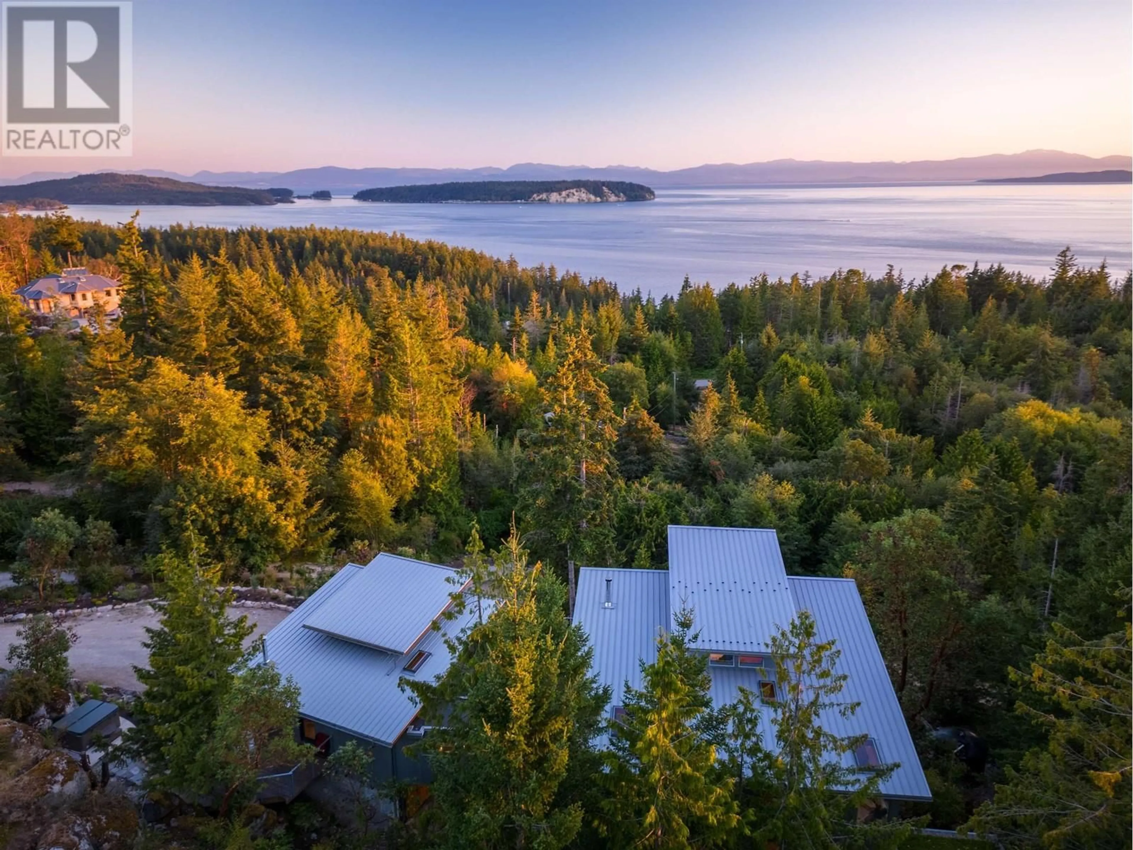 A pic from outside/outdoor area/front of a property/back of a property/a pic from drone, forest/trees view for 10710 WOOD BAY HEIGHTS ROAD, Halfmoon Bay British Columbia V7Z1B8