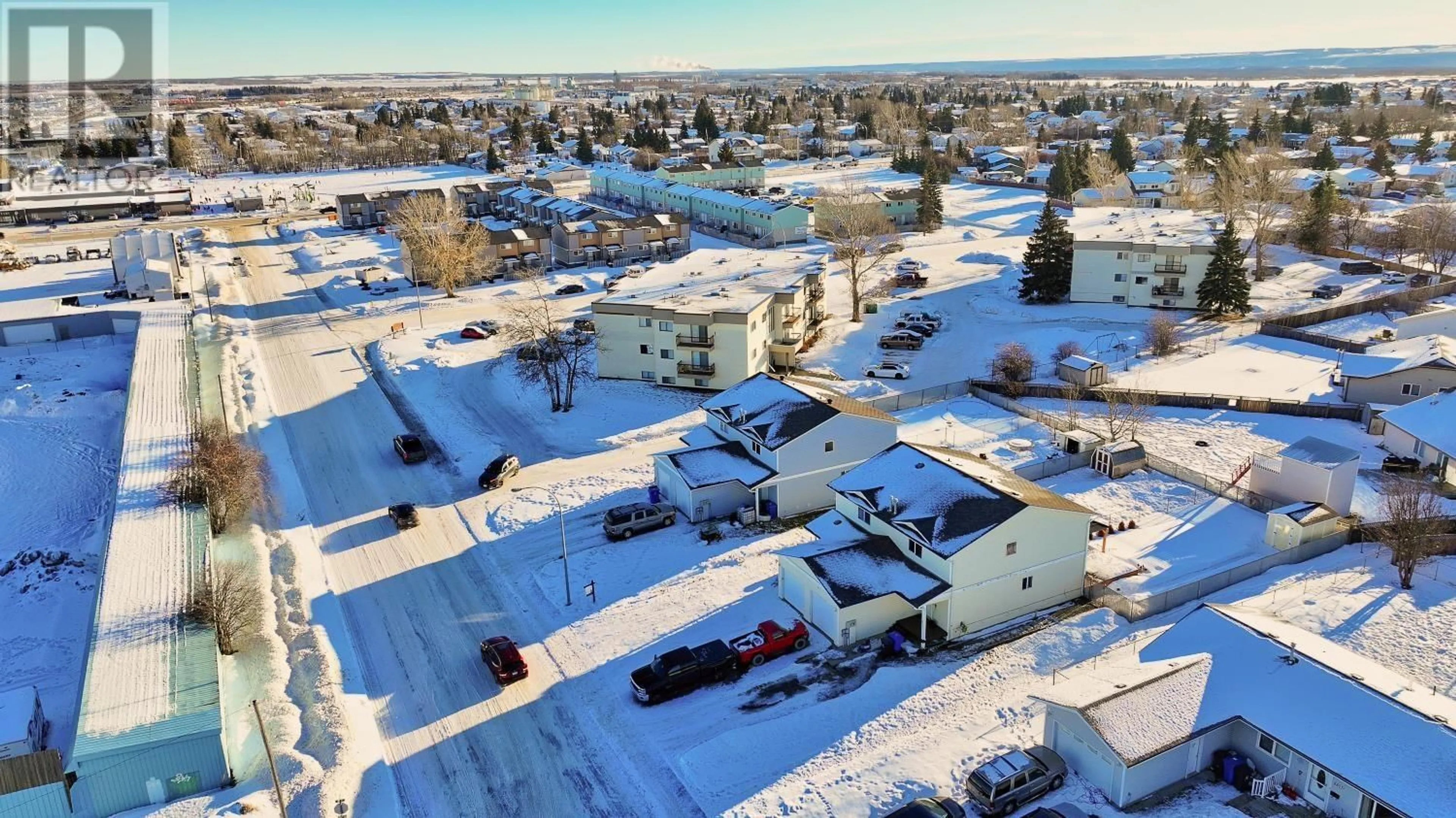 A pic from outside/outdoor area/front of a property/back of a property/a pic from drone, unknown for 8719 99 AVENUE, Fort St. John British Columbia V1J6T9