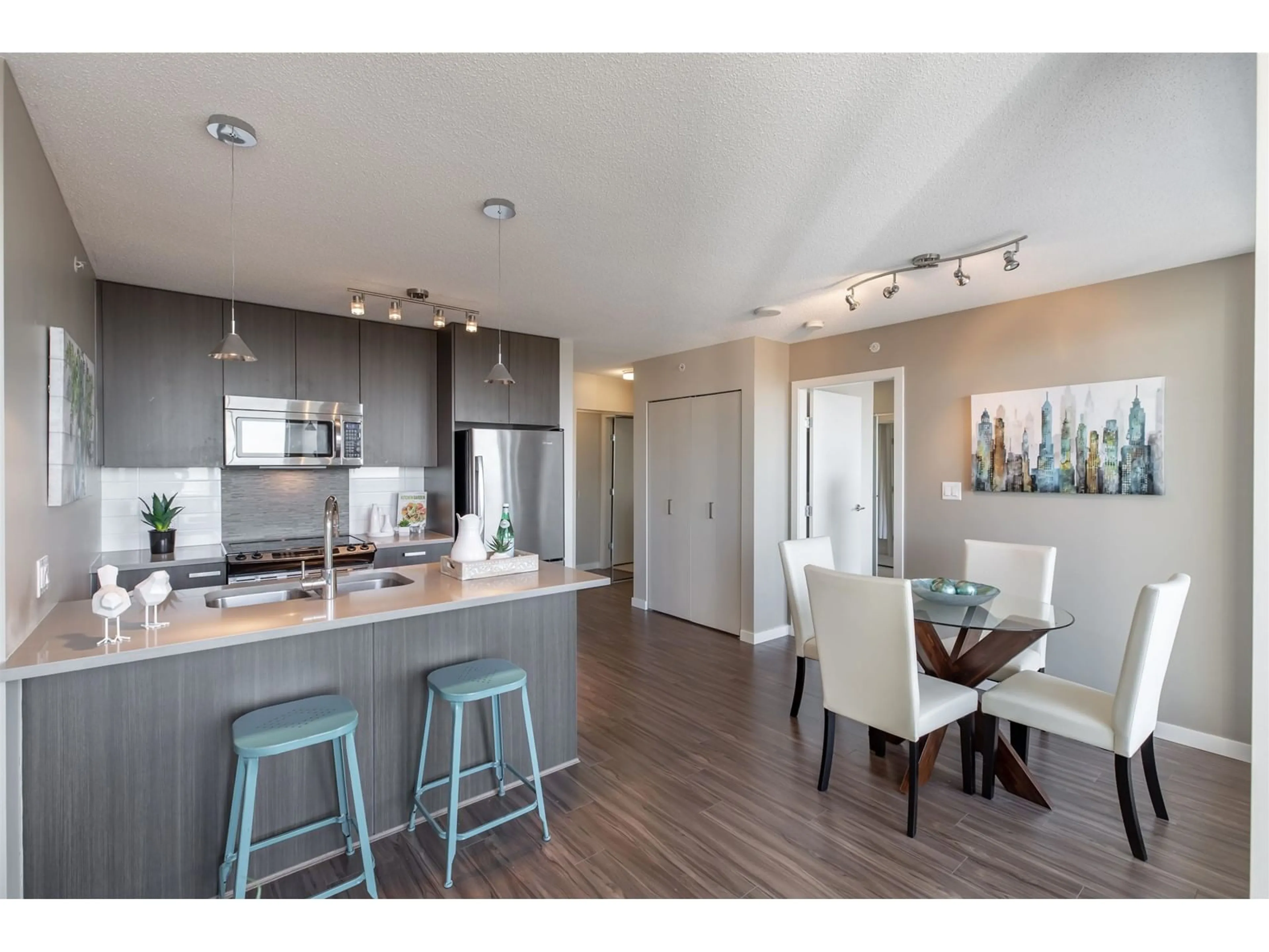 Open concept kitchen, wood/laminate floor for 2215 - 13325 102A, Surrey British Columbia V3T0J5