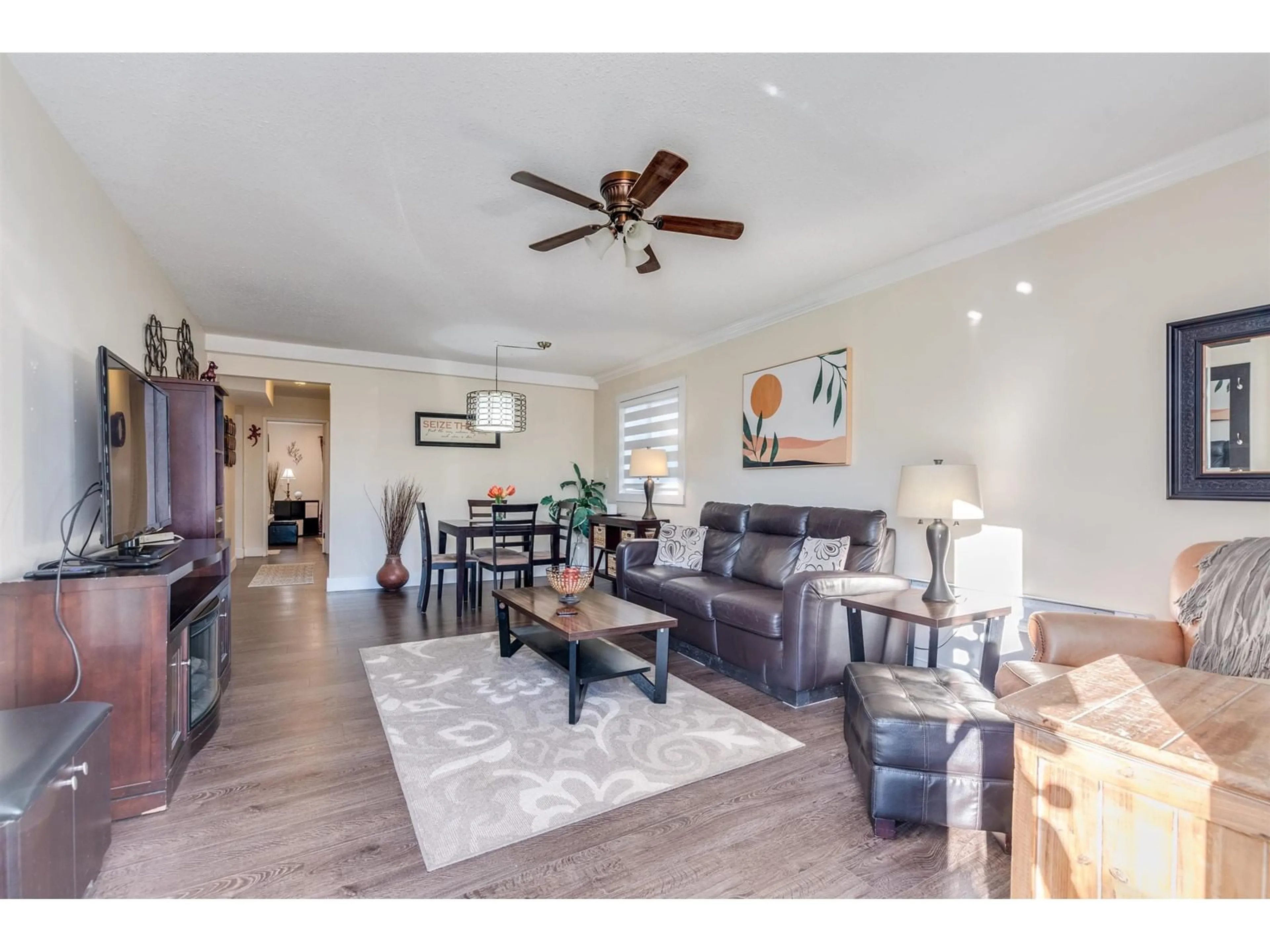 Living room with furniture, wood/laminate floor for 7707 PINTAIL STREET, Mission British Columbia V2V6H3