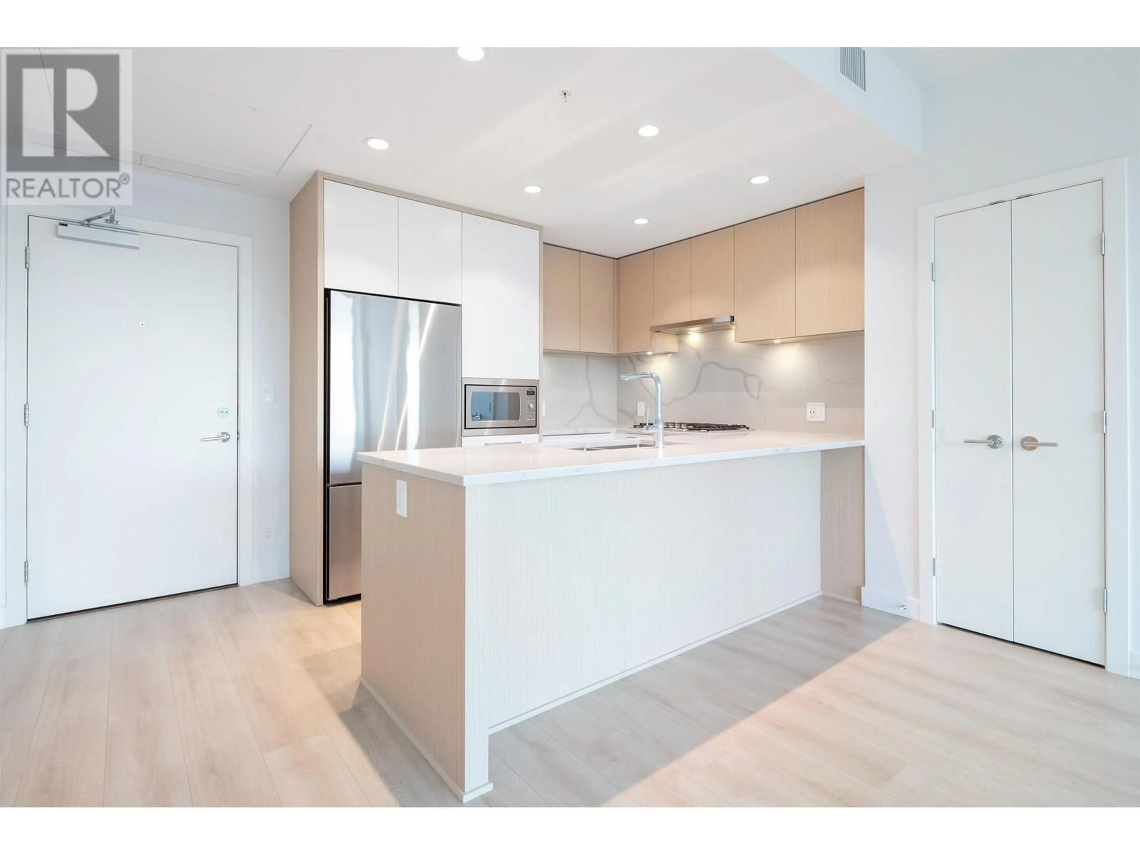 Open concept kitchen, unknown for 2303 567 CLARKE ROAD, Coquitlam British Columbia V3J0K7