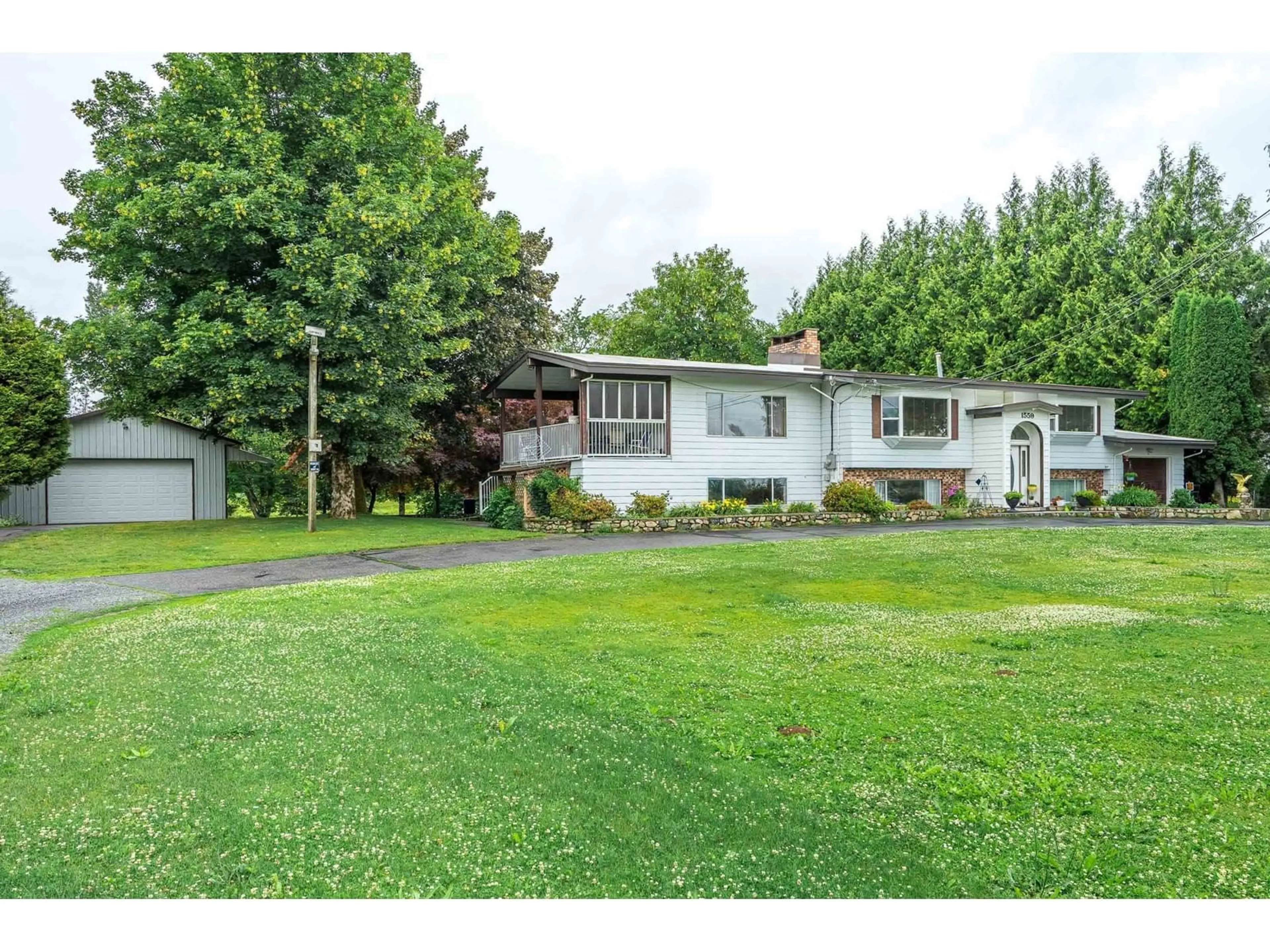 A pic from outside/outdoor area/front of a property/back of a property/a pic from drone, street for 1559 WHATCOM ROAD, Abbotsford British Columbia V3G1Y9