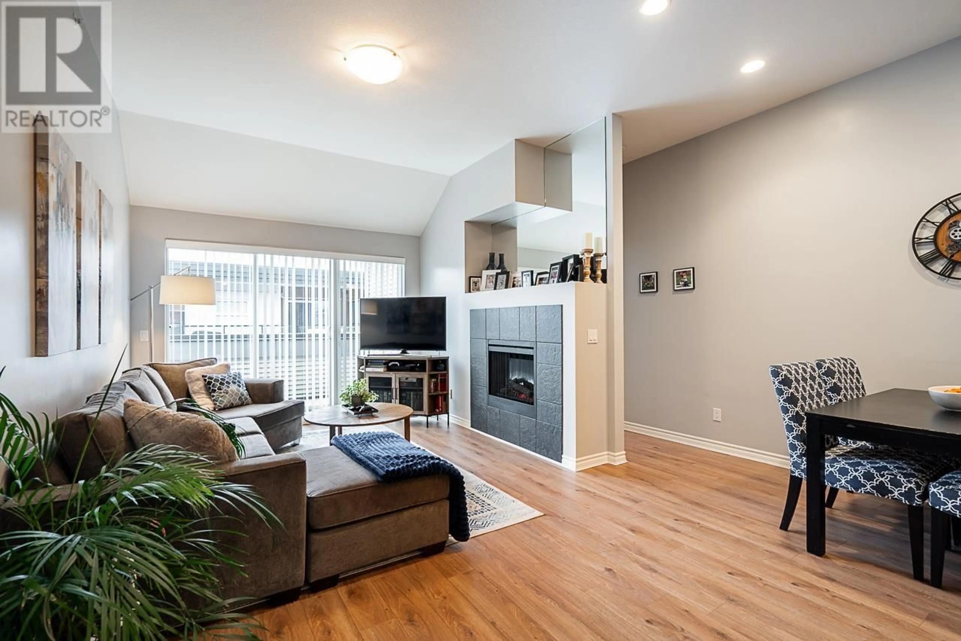 Living room with furniture, wood/laminate floor for 405 12090 227 STREET, Maple Ridge British Columbia V2X6J5