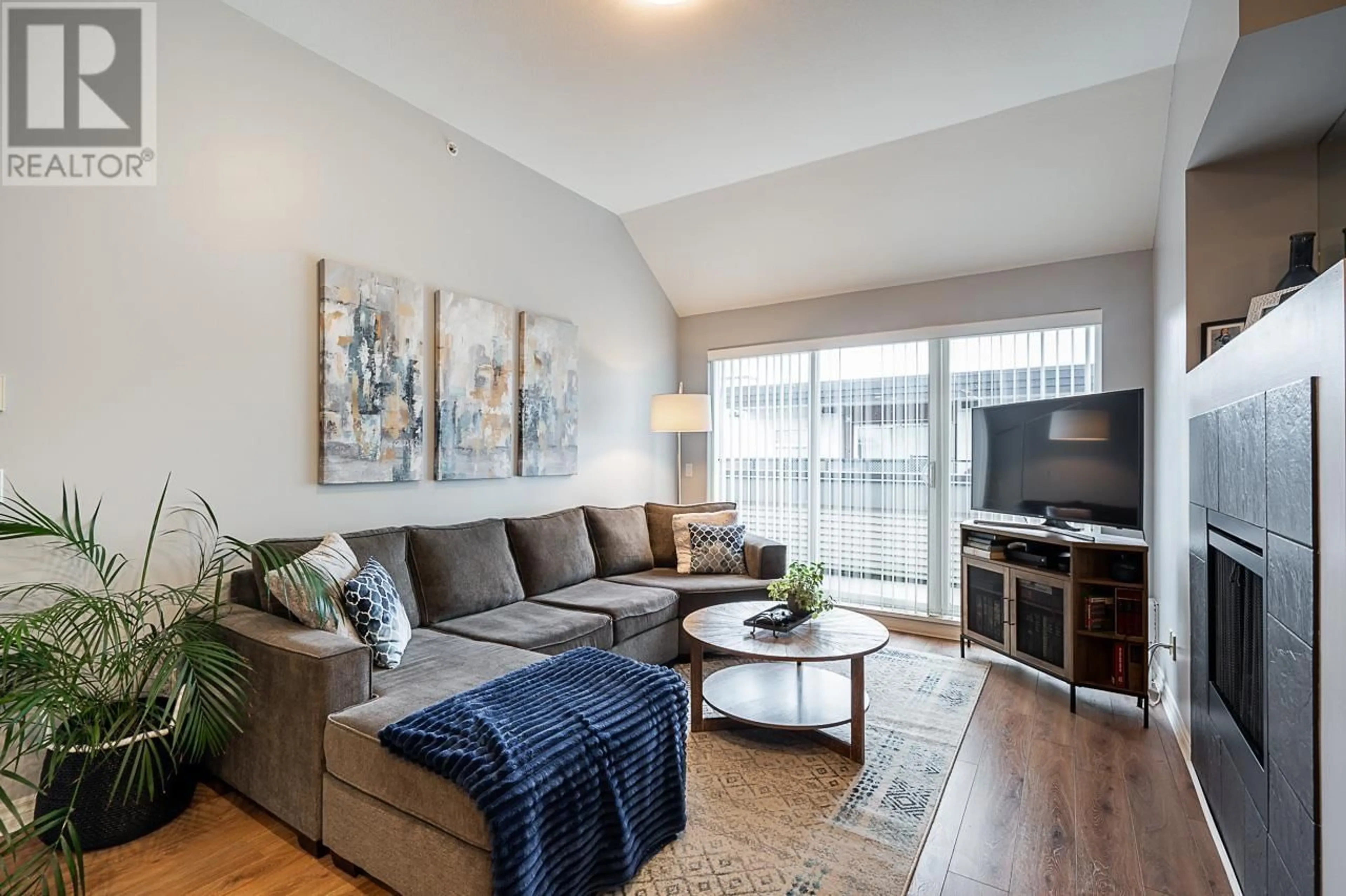 Living room with furniture, wood/laminate floor for 405 12090 227 STREET, Maple Ridge British Columbia V2X6J5