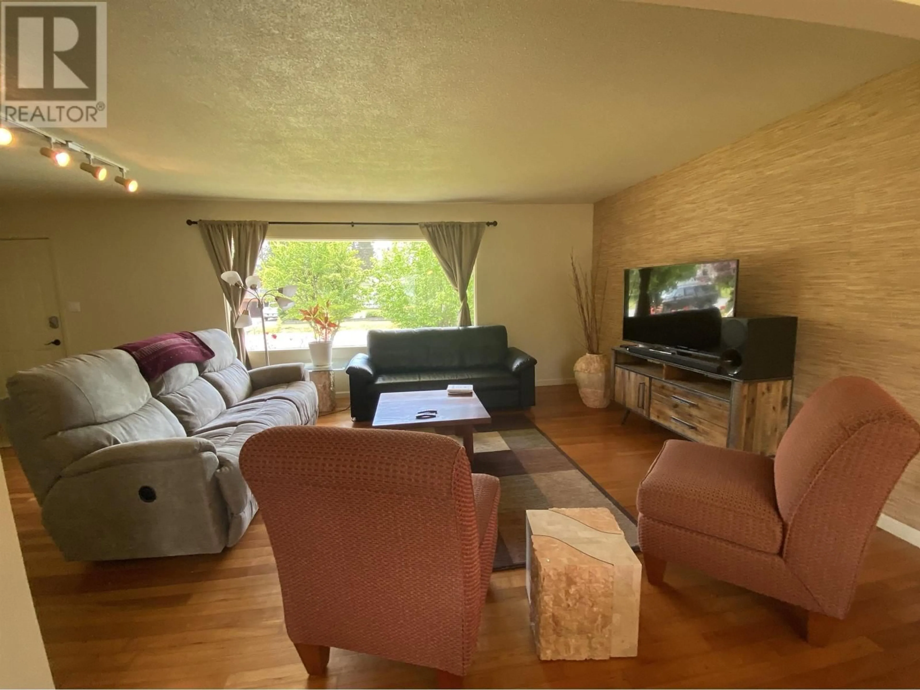 Living room with furniture, wood/laminate floor for 4724 TUCK AVENUE, Terrace British Columbia V8G2G5