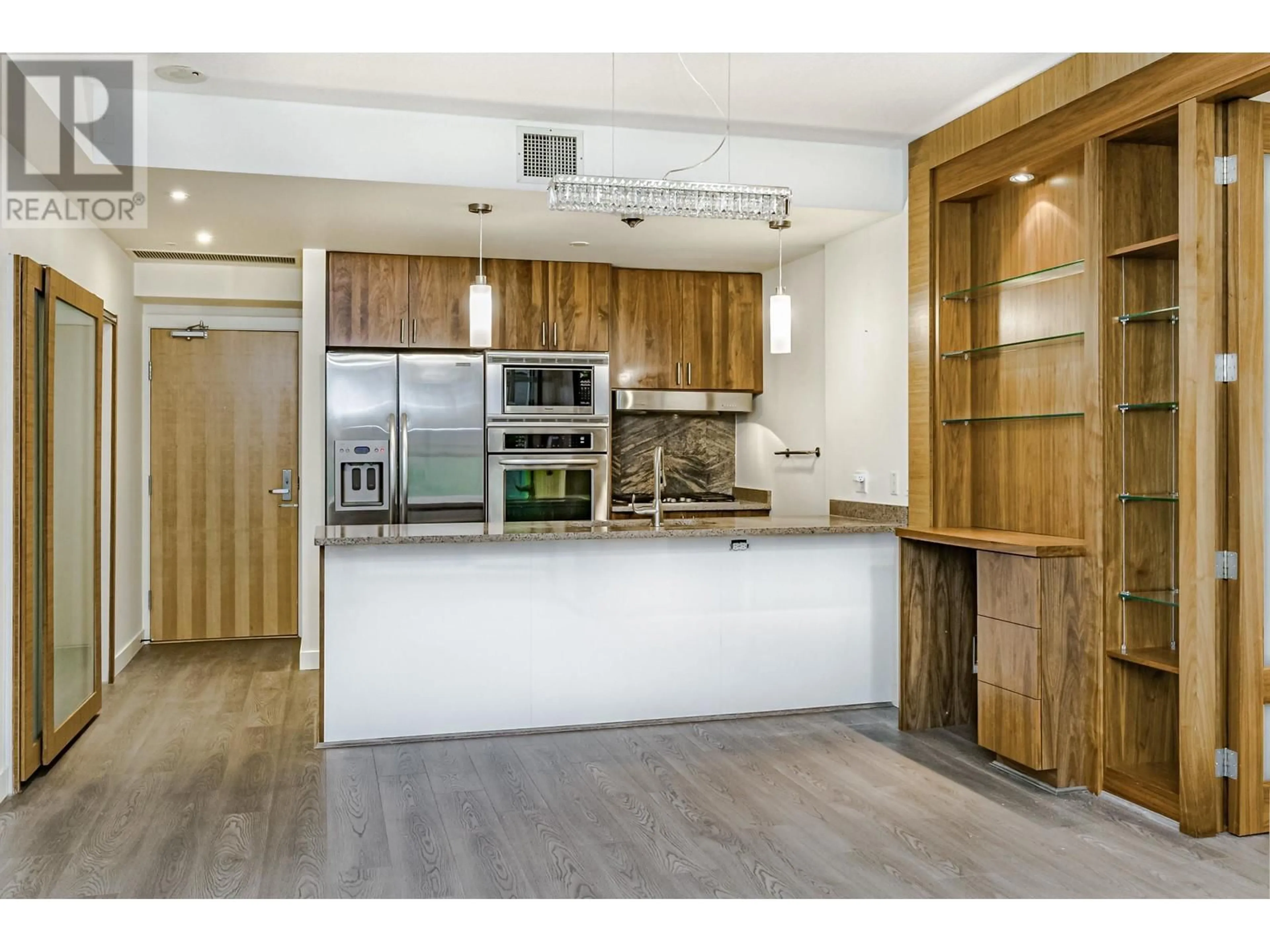 Open concept kitchen, wood/laminate floor for 404 1211 MELVILLE STREET, Vancouver British Columbia V6E0A7