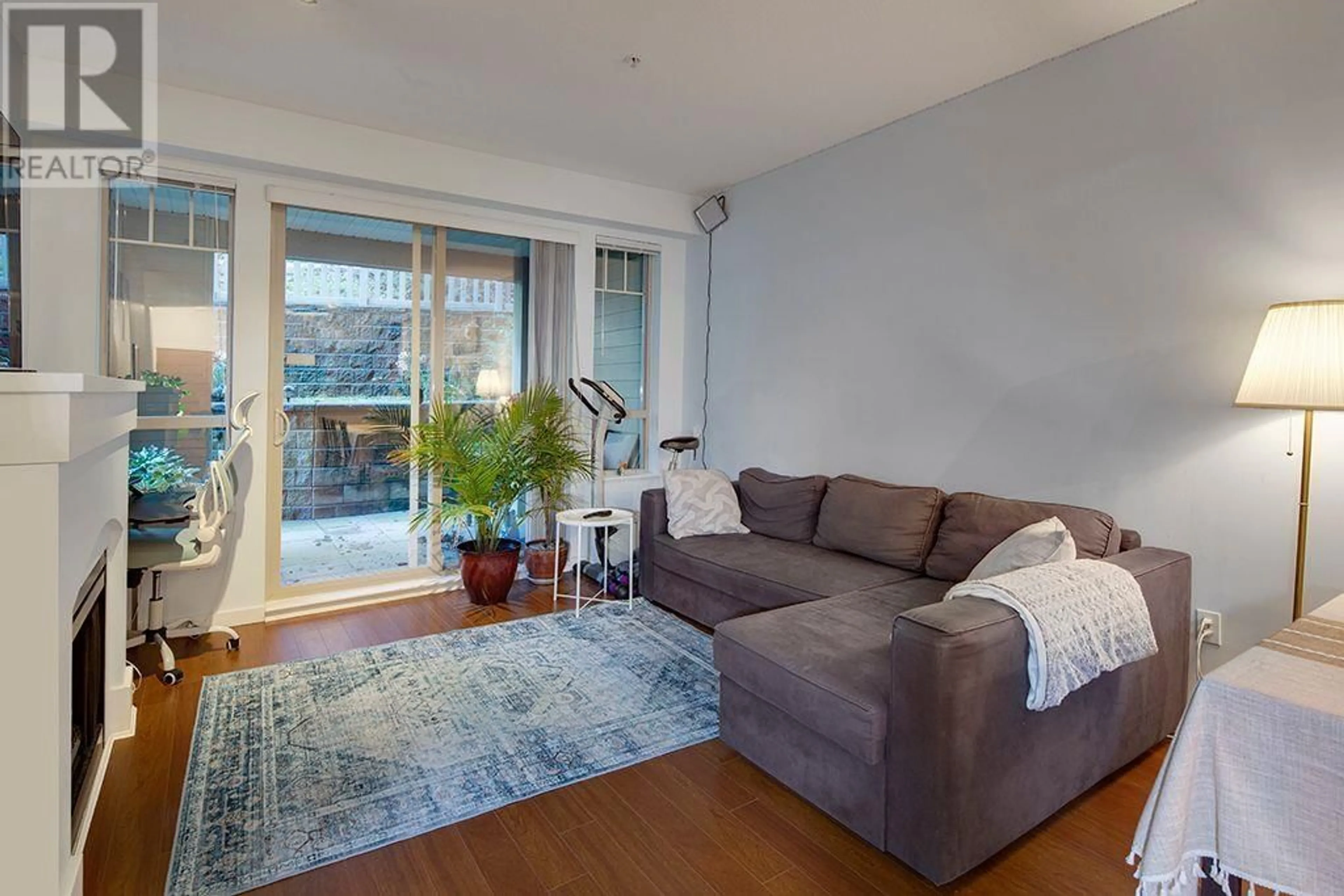 Living room with furniture, wood/laminate floor for 107 2951 SILVER SPRINGS BOULEVARD, Coquitlam British Columbia V3E3S4