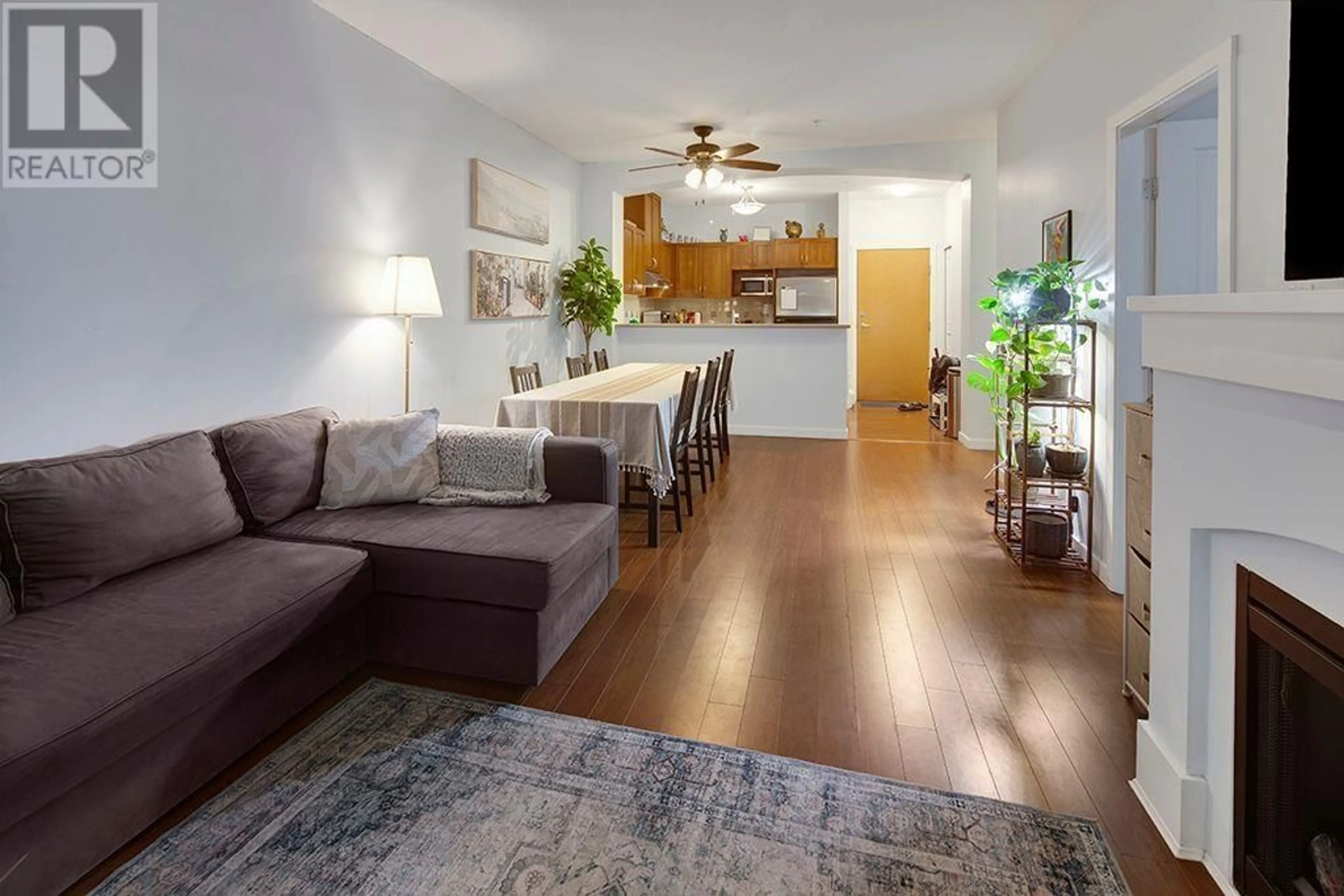 Living room with furniture, wood/laminate floor for 107 2951 SILVER SPRINGS BOULEVARD, Coquitlam British Columbia V3E3S4