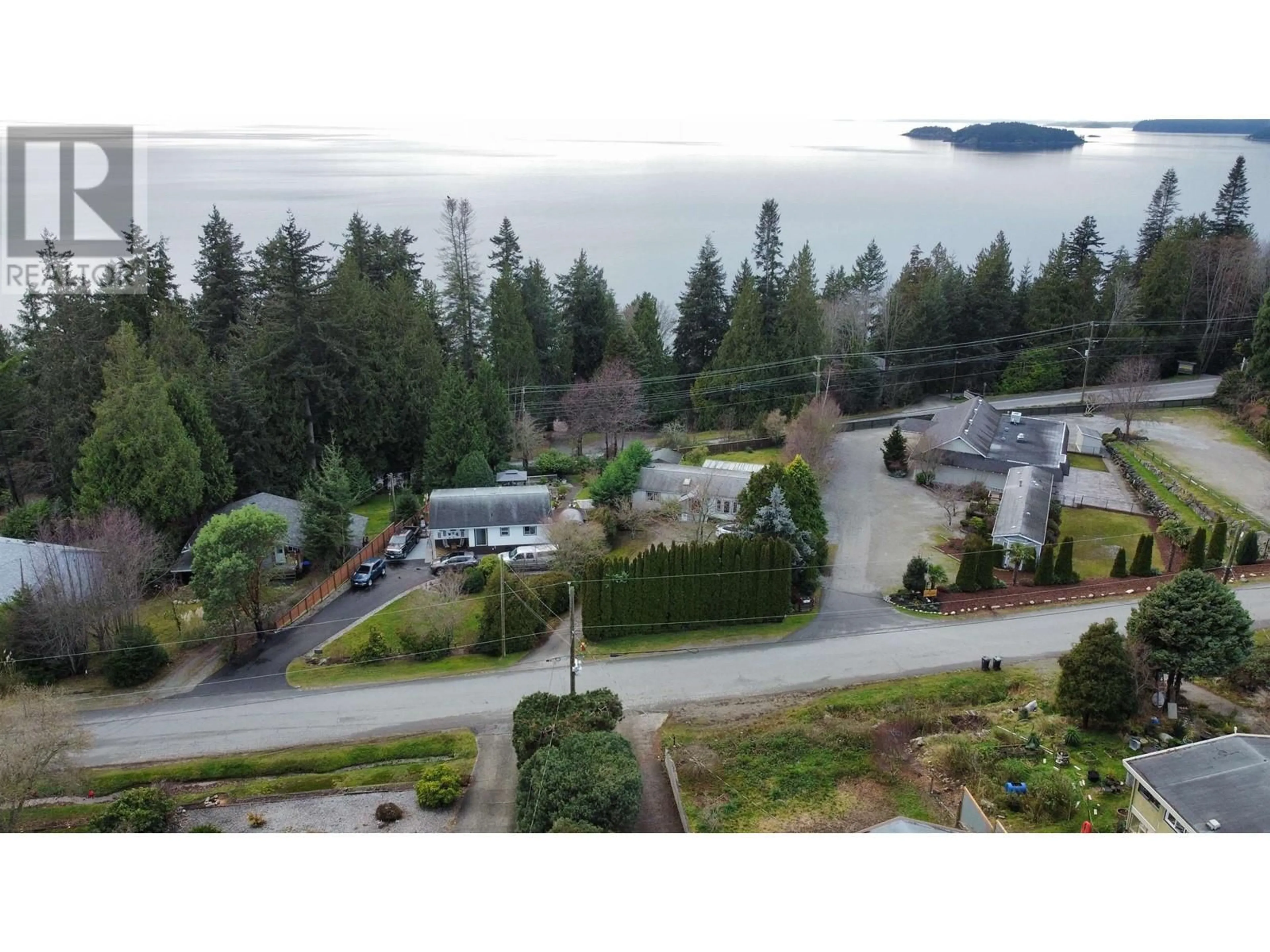 A pic from outside/outdoor area/front of a property/back of a property/a pic from drone, water/lake/river/ocean view for 4933 GEER ROAD, Sechelt British Columbia V7Z0B7