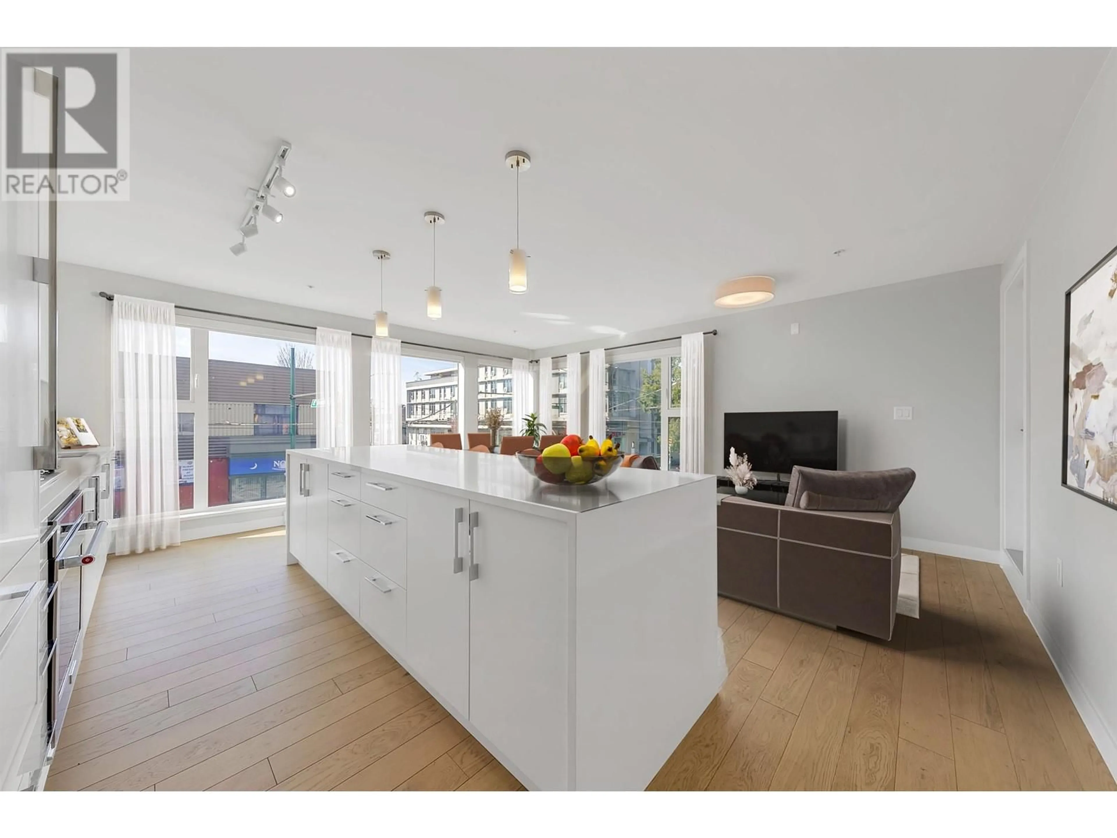 Open concept kitchen, unknown for 202 2508 FRASER STREET, Vancouver British Columbia V5T3V4