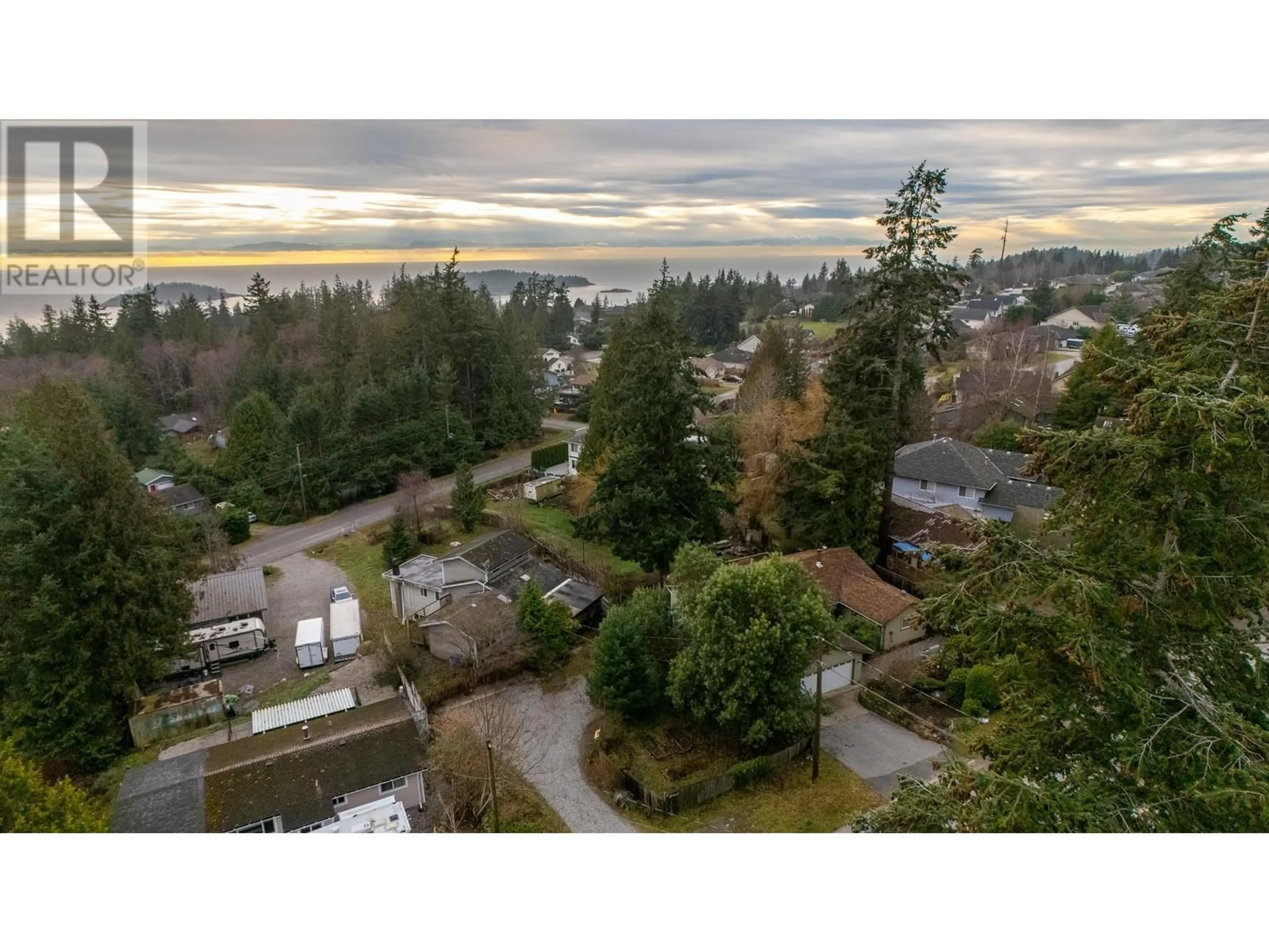 A pic from outside/outdoor area/front of a property/back of a property/a pic from drone, water/lake/river/ocean view for 6279 NORWEST BAY ROAD, Sechelt British Columbia V7Z0M5