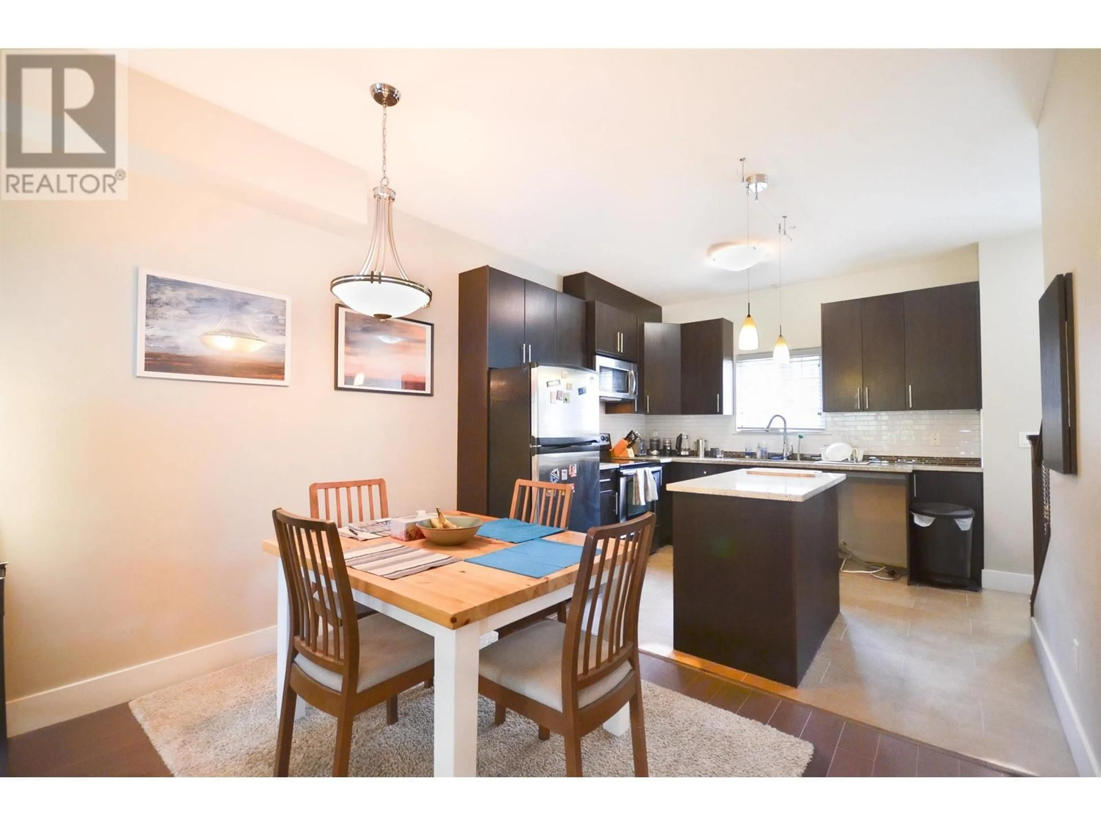 Open concept kitchen, wood/laminate floor for 219 368 ELLESMERE AVENUE, Burnaby British Columbia V5B3S9