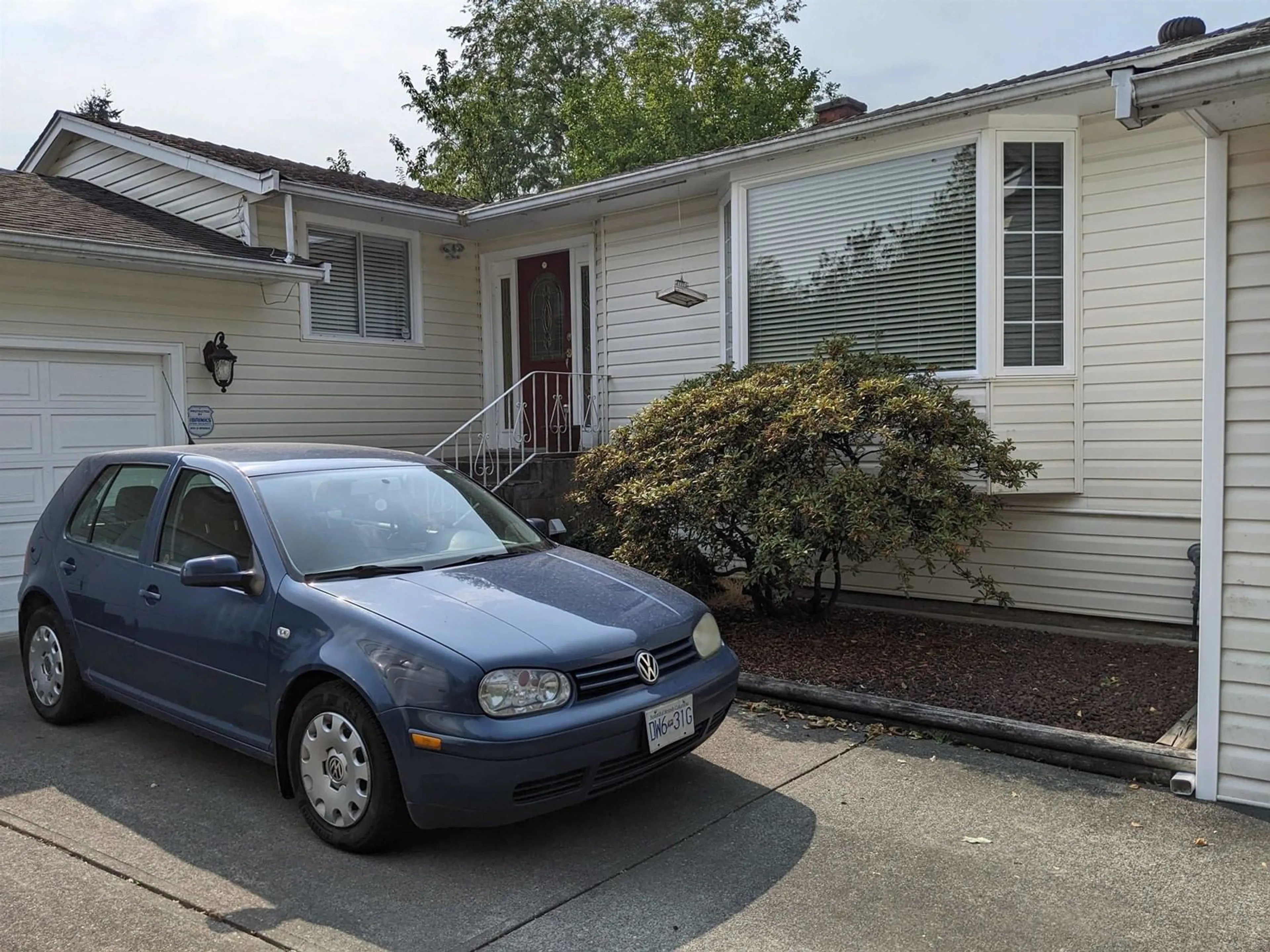Home with vinyl exterior material, street for 16428 12, Surrey British Columbia V4A9H6