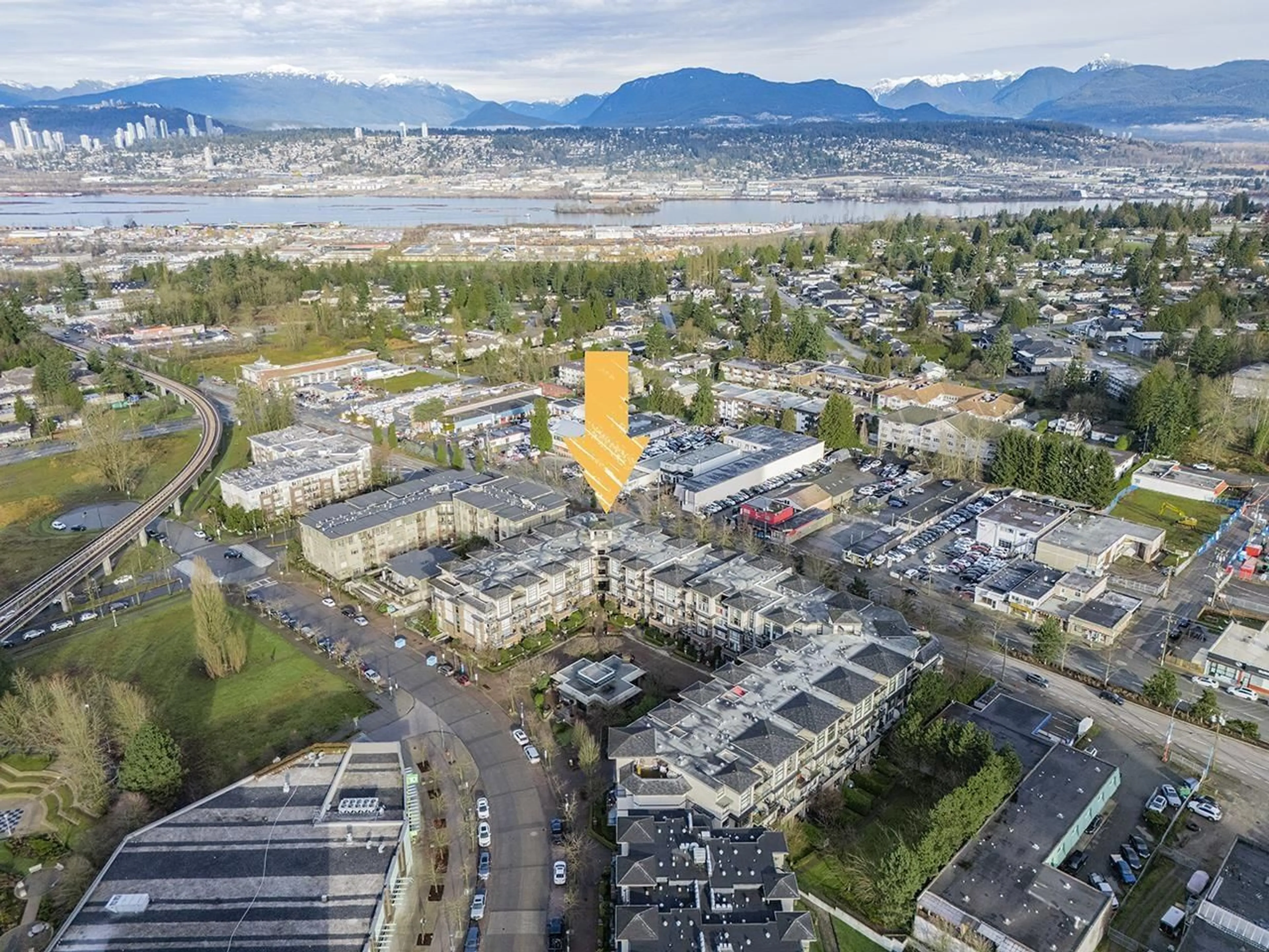 A pic from outside/outdoor area/front of a property/back of a property/a pic from drone, mountain view for 206 10866 CITY PARKWAY, Surrey British Columbia V3T5W9