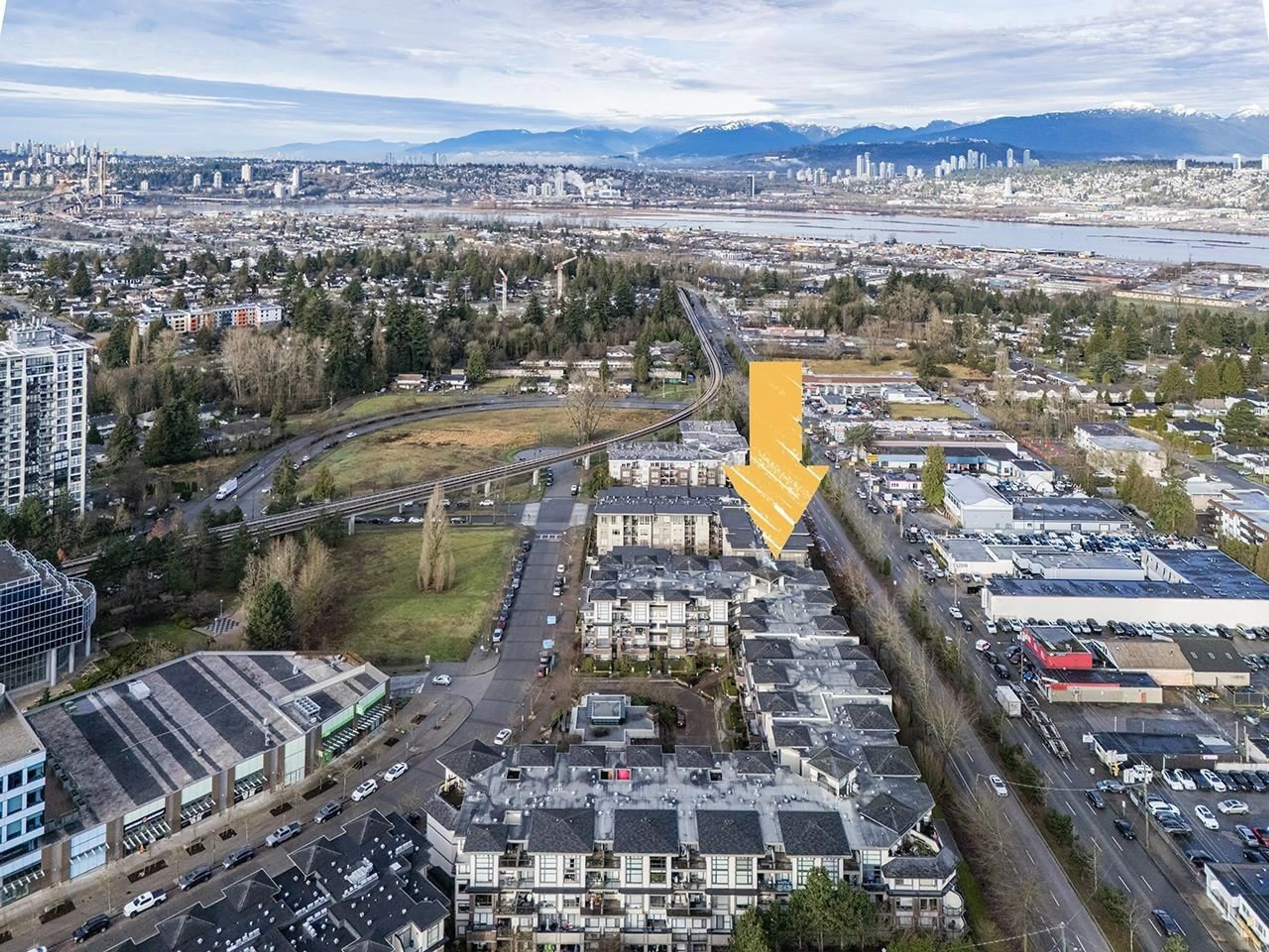 A pic from outside/outdoor area/front of a property/back of a property/a pic from drone, mountain view for 206 10866 CITY PARKWAY, Surrey British Columbia V3T5W9