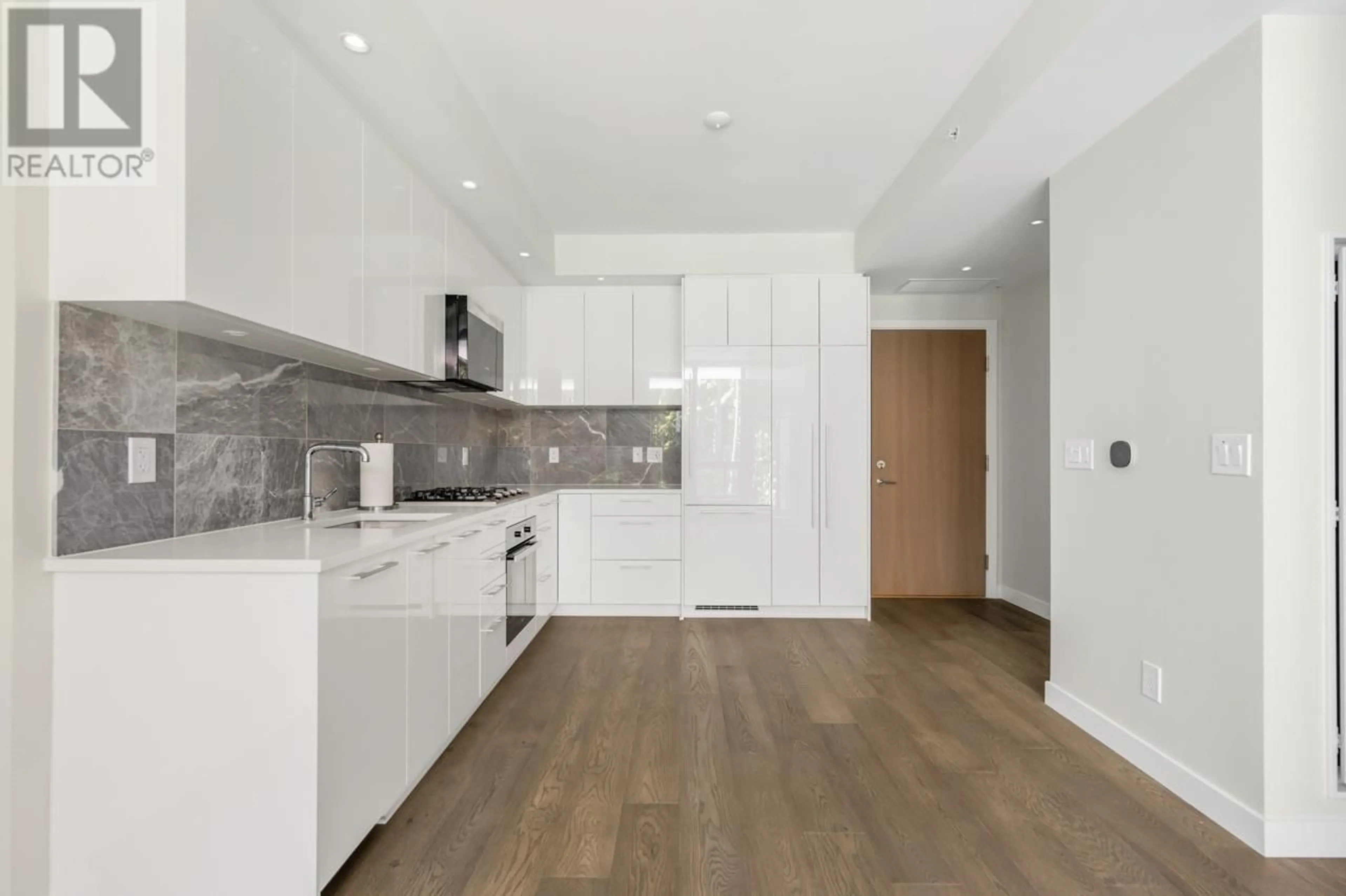 Open concept kitchen, wood/laminate floor for 708 5608 BERTON AVENUE, Vancouver British Columbia V6S0M6