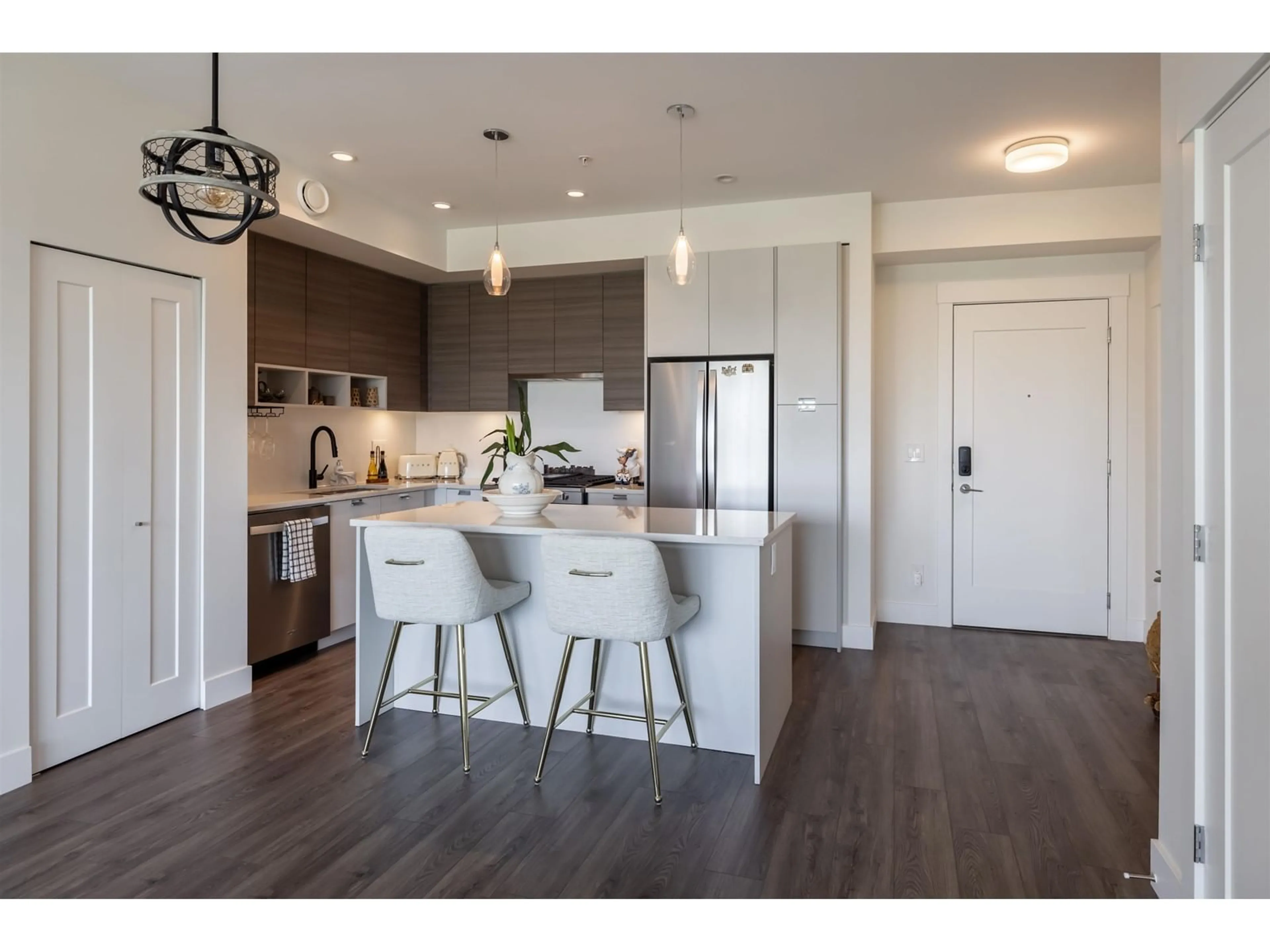 Open concept kitchen, wood/laminate floor for A223 20727 WILLOUGHBY TOWN CENTRE DRIVE, Langley British Columbia V2Y3N1