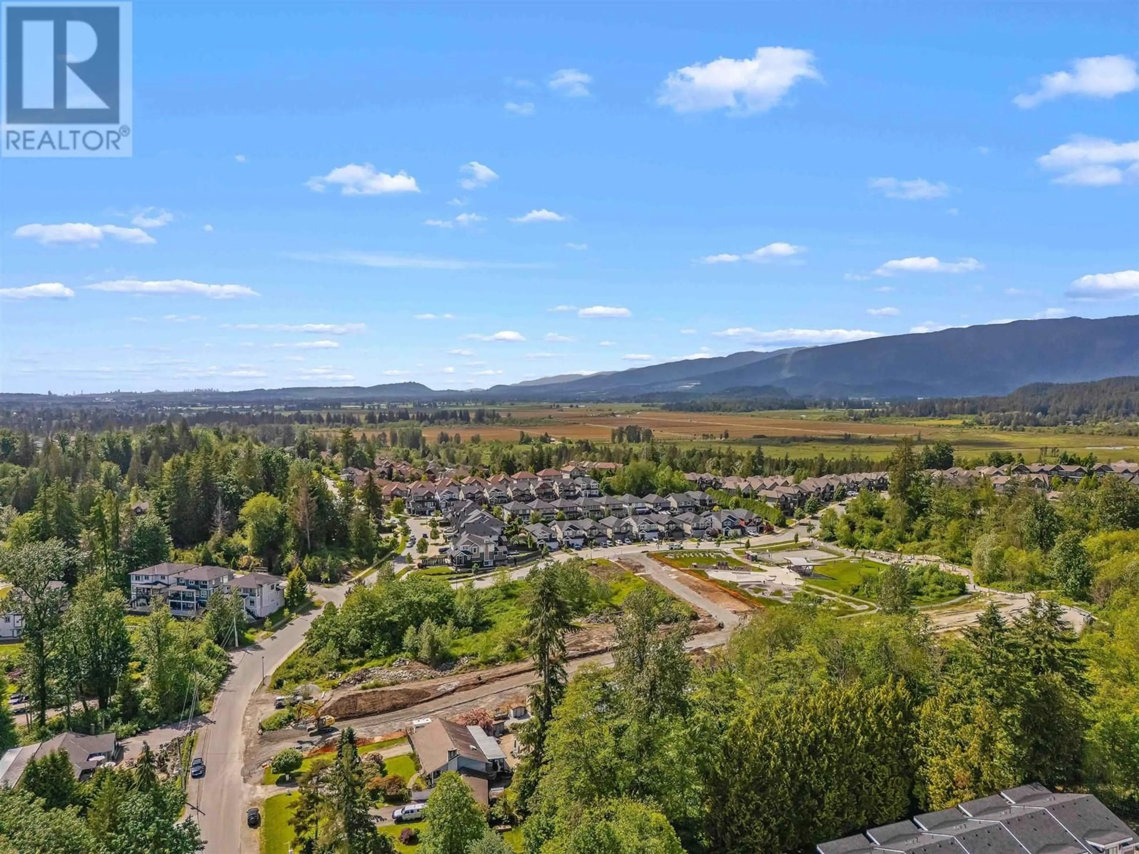 A pic from outside/outdoor area/front of a property/back of a property/a pic from drone, mountain view for 1 23183 136 AVENUE, Maple Ridge British Columbia V4R0H9